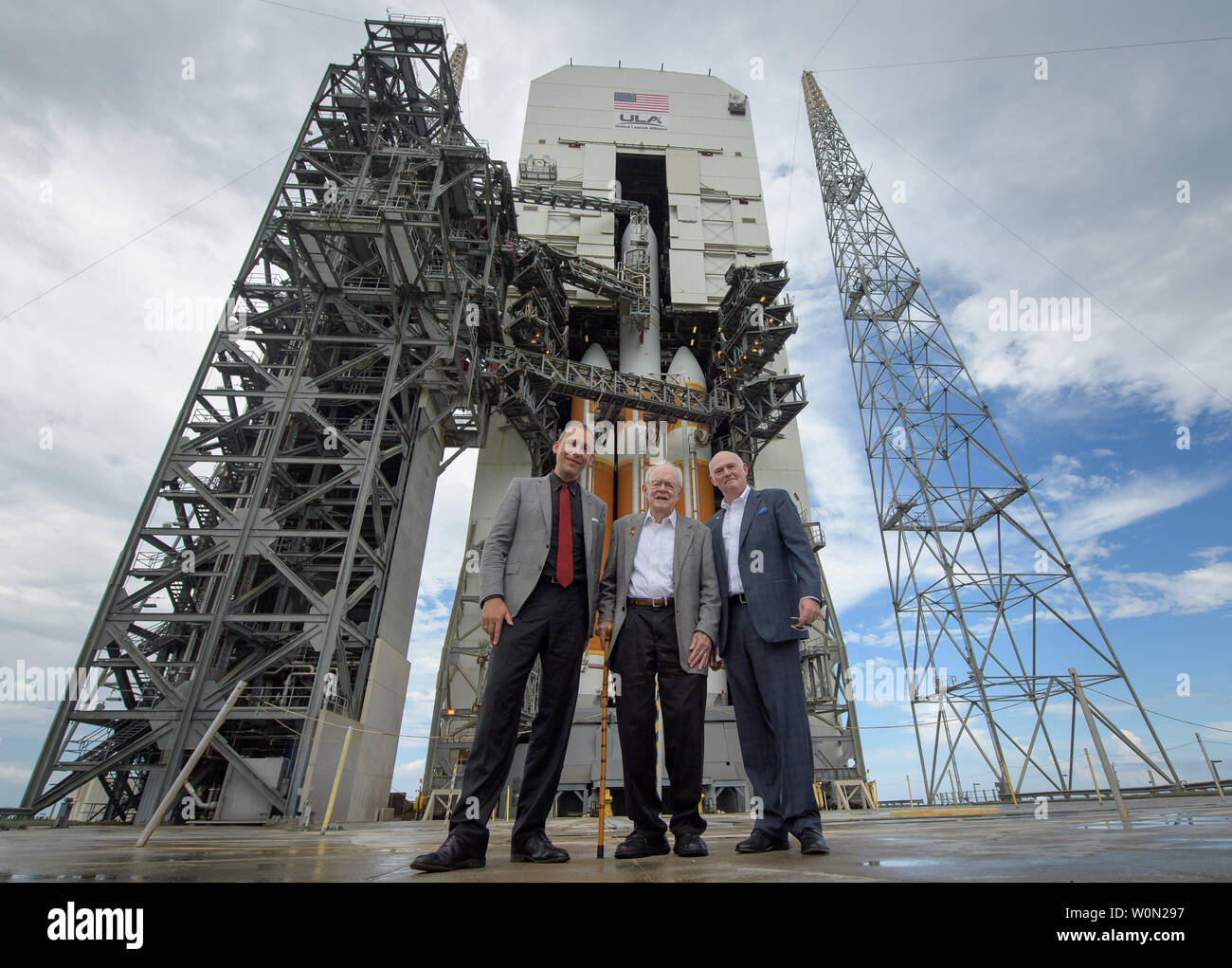 NASA Associate Administrator for the Science Mission Directorate Thomas Zurbuchen, left, American solar astrophysicist, and professor emeritus at the University of Chicago, Eugene Parker, center, and President and Chief Executive Officer for United Launch Alliance Tory Bruno pose for a group photo in front of  the ULA Delta IV Heavy rocket with NASA's Parker Solar onboard, on August 10, 2018, Launch Complex 37 at Cape Canaveral Air Force Station, Florida. This is the first NASA mission that has been named for a living individual. Parker Solar Probe is humanity's first-ever mission into a part Stock Photo