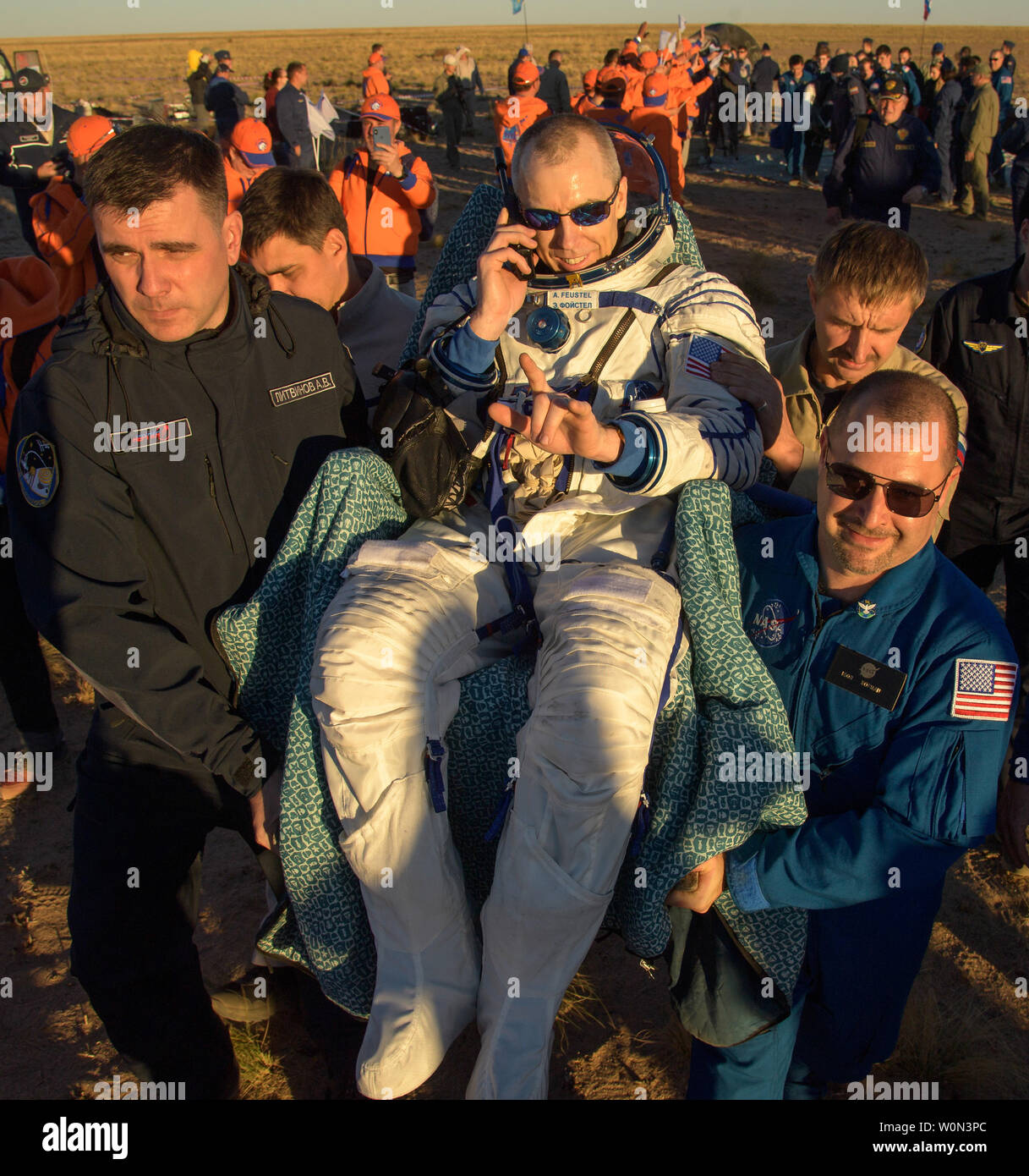 Expedition 56 Commander Drew Feustel of NASA is carried to a medical tent shortly after he, Expedition 56 Flight Engineer Ricky Arnold of NASA, and Expedition 56 Flight Engineer and Soyuz Commander Oleg Artemyev of Roscosmos landed in their Soyuz MS-08 spacecraft near the town of Zhezkazgan, Kazakhstan on October 4, 2018. Feustel, Arnold, and Artemyev are returning after 197 days in space where they served as members of the Expedition 55 and 56 crews onboard the International Space Station. NASA Photo by Bill Ingalls/UPI Stock Photo