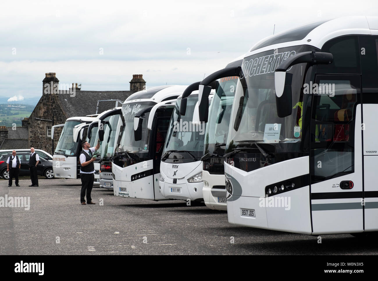 Row of  tourist coaches in car park at  Stirling Castle in Scotland, UK Stock Photo