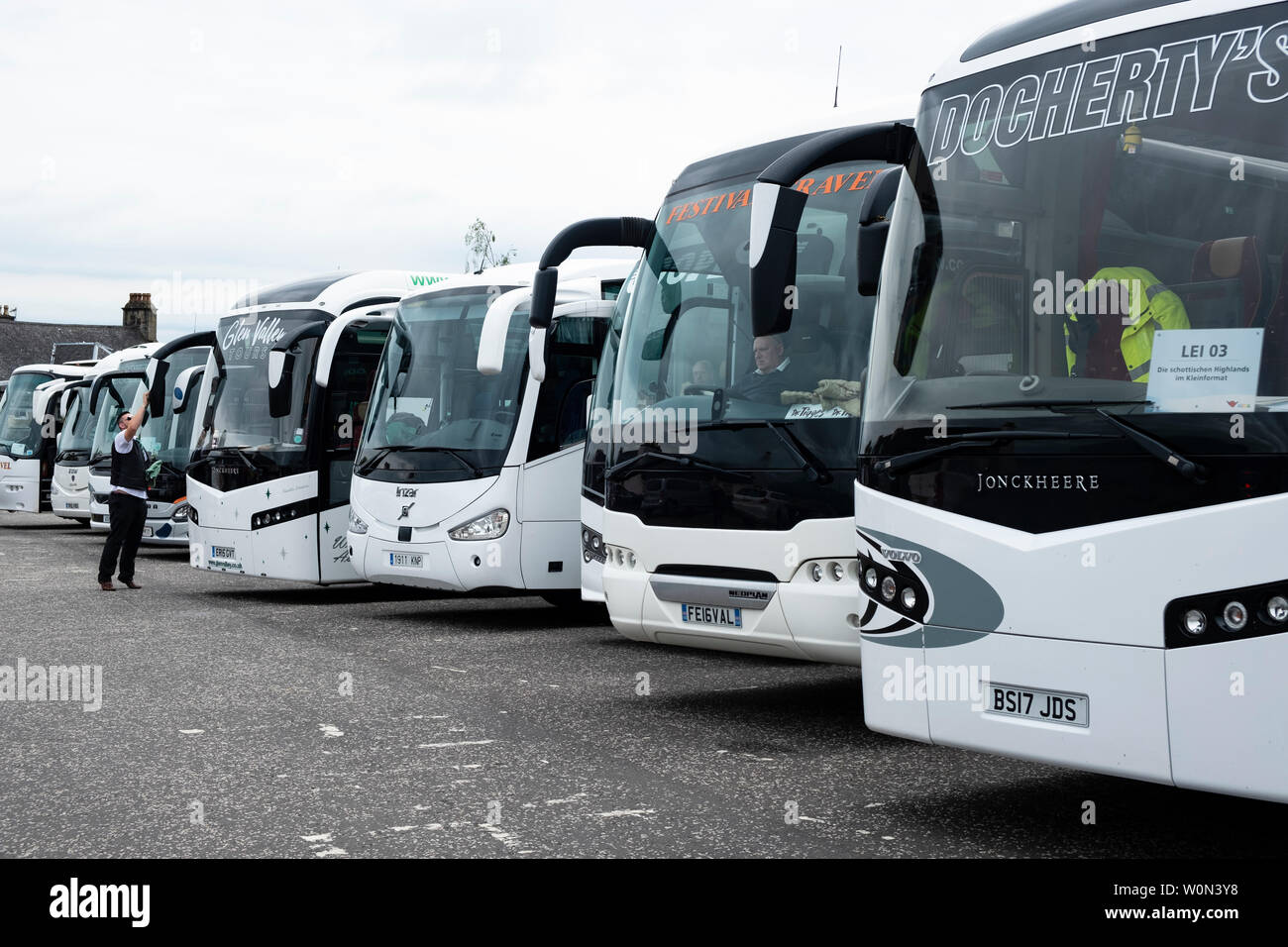 Row of  tourist coaches in car park at  Stirling Castle in Scotland, UK Stock Photo