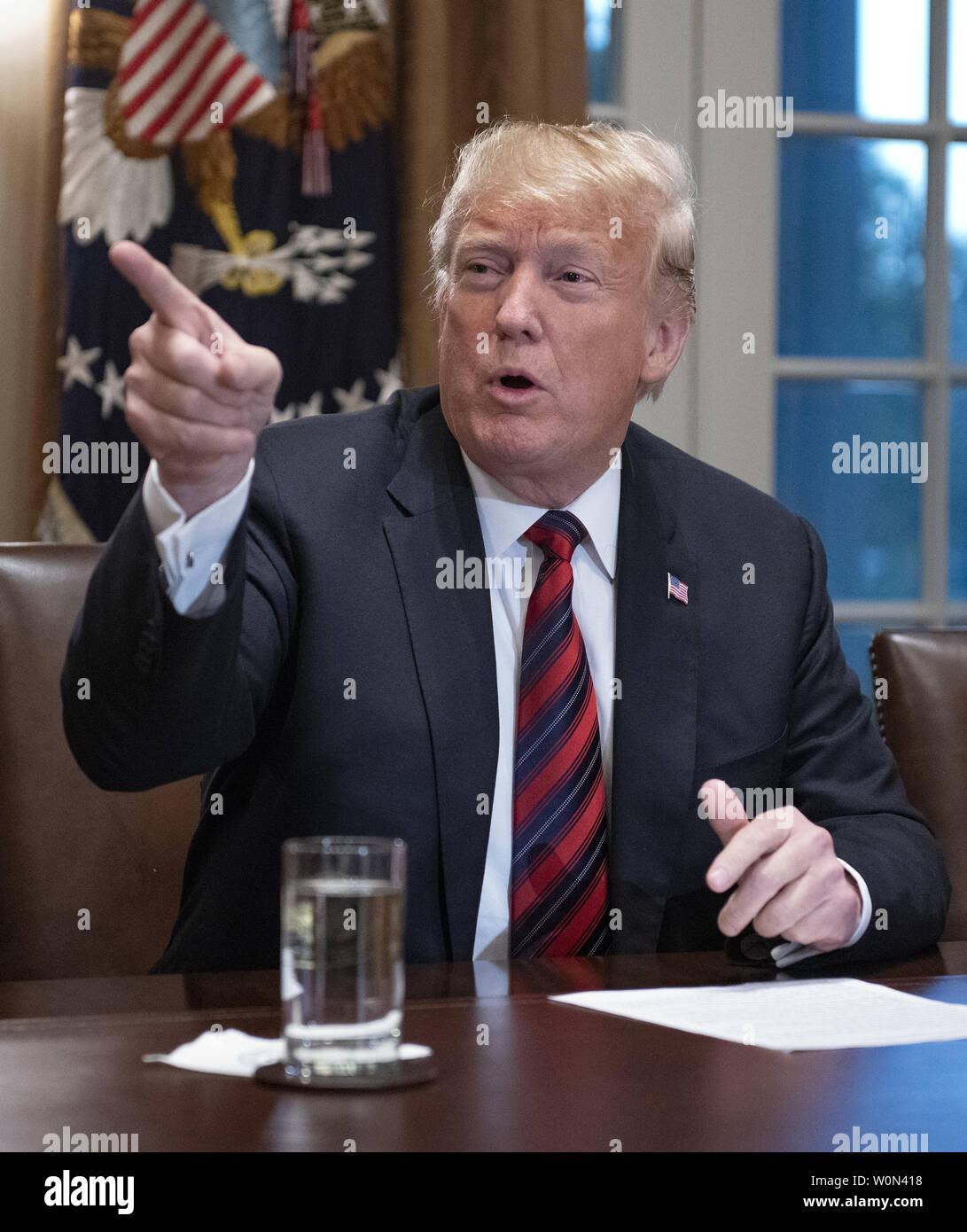 United States President Donald J. Trump makes a statement to the media as he prepares to receive a briefing from senior military leaders in the Cabinet Room of the White House in Washington, DC on Tuesday, October 23, 2018.  The President took questions on the proposed space force, immigration, the caravan and Saudi actions in the killing of Jamal Khashoggi.   Photo by Ron Sachs/UPI Stock Photo