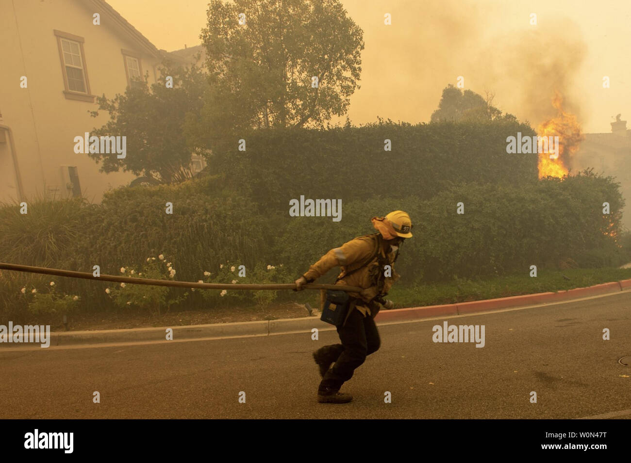 A Firefighter With The Los Angeles County Fire Department Is Pictured ...