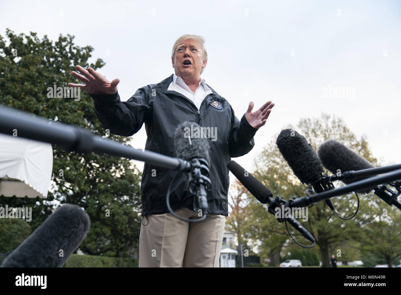 U.S. President Donald Trump speaks to the media before he departs the White House for California, where he is scheduled to view damage from that state's wildfires, in Washington, DC, on November 17, 2018. Seventy-four people have been killed and more than 1,000 people are missing due to multiple devastating fires across the state. The President spoke about the investigation into Jamal Khashoggi's murder, the Mueller investigation, and the migrant caravan approaching the southern border.   Photo by Jim Lo Scalzo/UPI Stock Photo