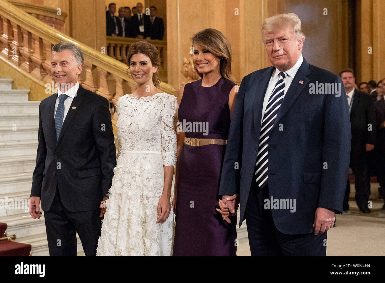 President Donald J. Trump and First Lady Melania Trump are greeted by  Argentine President Mauricio Macri and First Lady Juliana Awada upon their  arrival on November 30, 2018, at the Teatro Colon