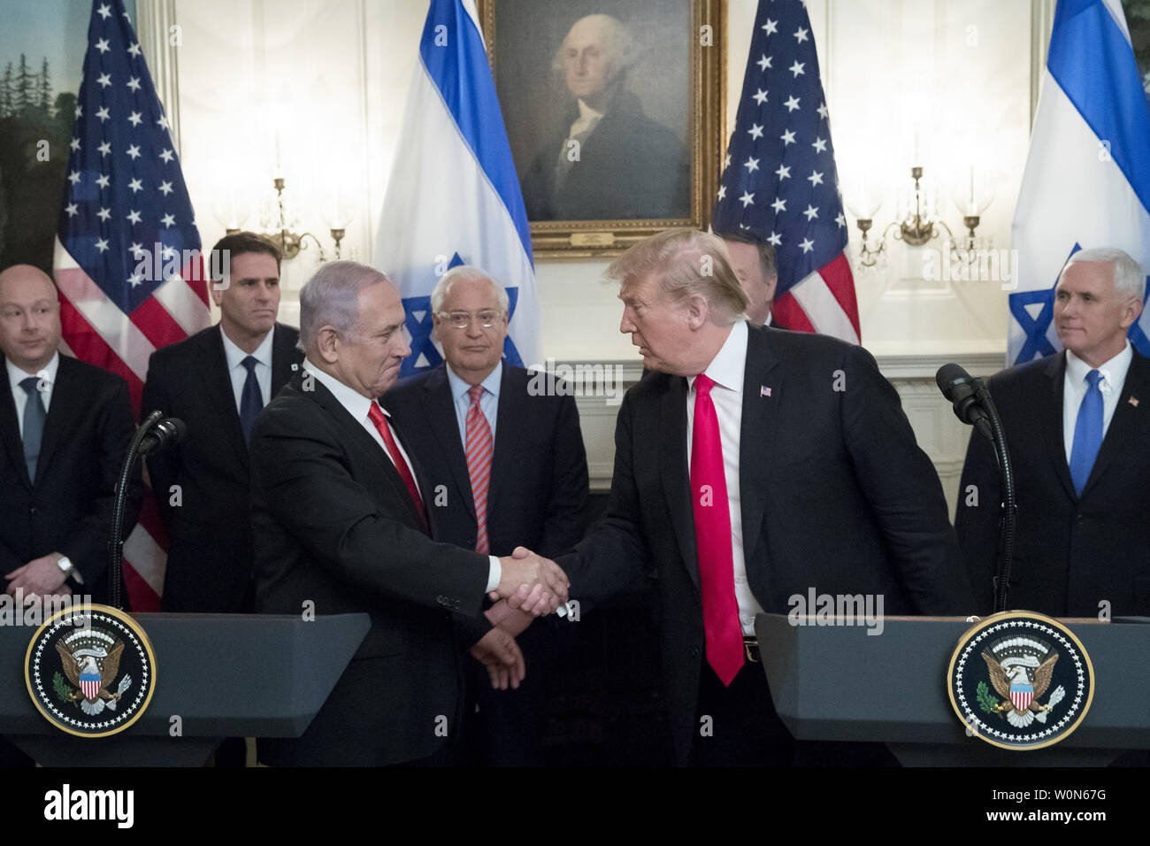 President Donald Trump and Israeli Prime Minister Benjamin Netayahu shake hands after Trump signed an order recognizing the Golan Heights as Israeli territory  in the Diplomatic Reception Room of the White House in Washington, DC on March 25, 2019.     Photo by Michael Reynolds/UPI Stock Photo