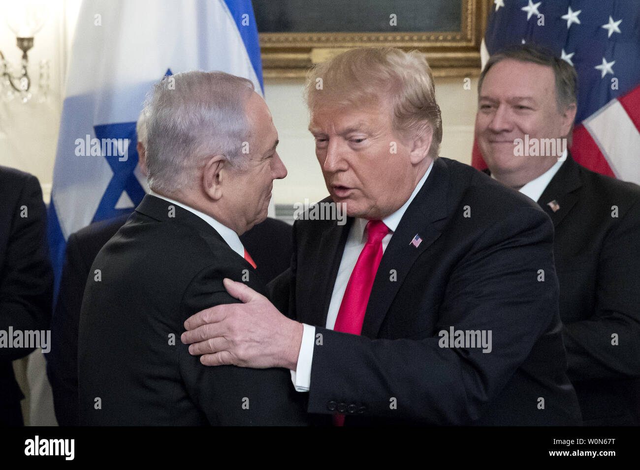 President Donald Trump is hugged by Israeli Prime Minister Benjamin Netayahu  after Trump signed an order recognizing the Golan Heights as Israeli territory  in the Diplomatic Reception Room of the White House in Washington, DC on March 25, 2019.     Photo by Michael Reynolds/UPI Stock Photo
