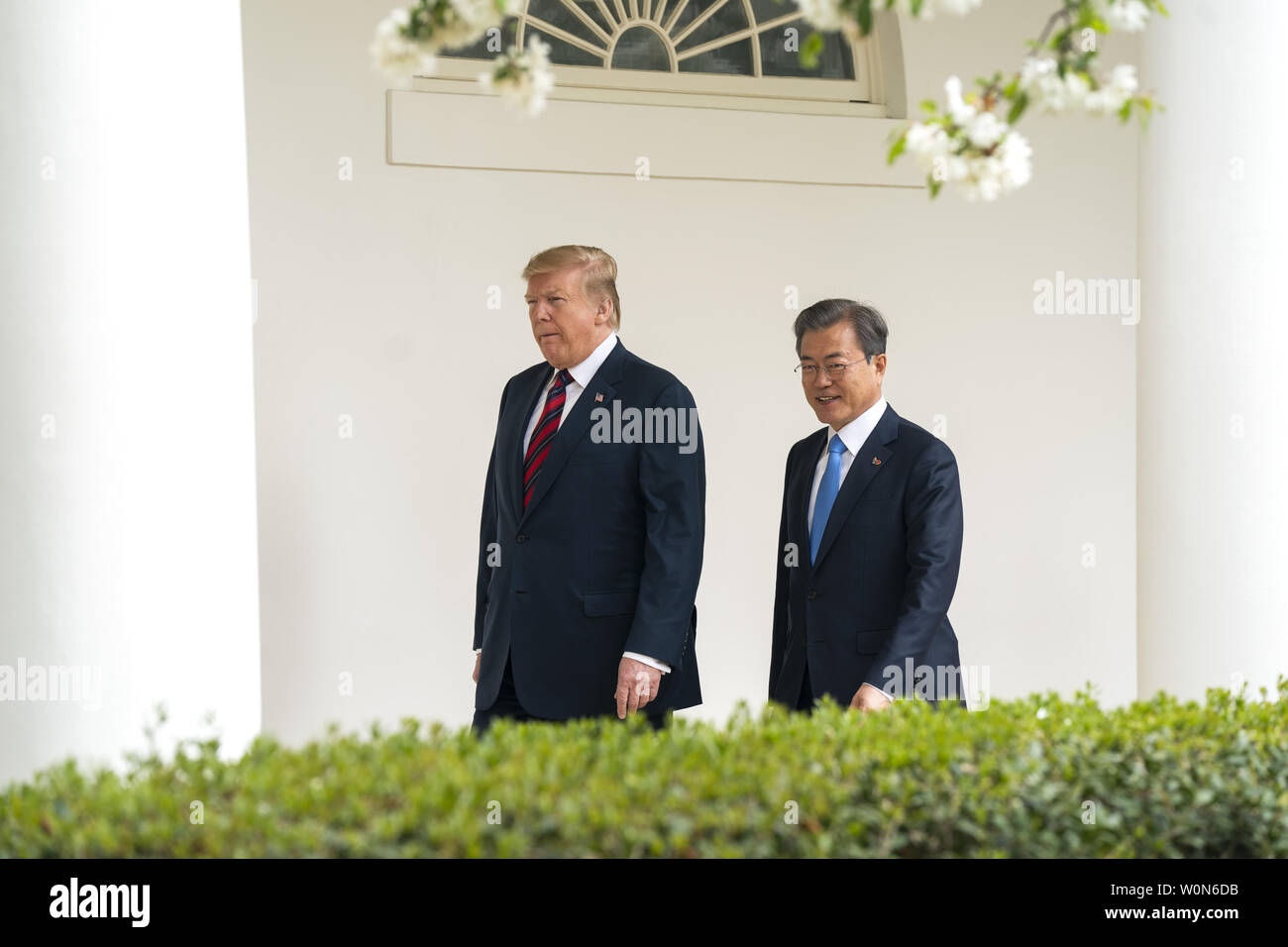 US President Donald J. Trump (L) and Korean President Moon Jae-in (R) walk along the Colonnade of the White House in Washington on April 11, 2019. President Moon is expected to ask President Trump to reduce sanctions on North Korea in an attempt to jump start nuclear negotiations between North Korea and the US.  Photo by Jim Lo Scalzo/UPI Stock Photo