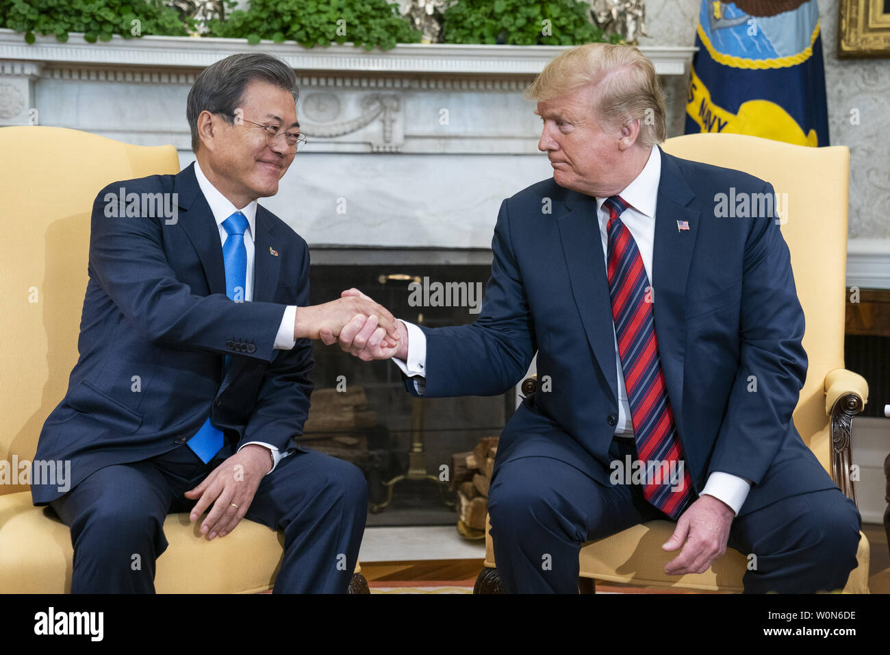 US President Donald J. Trump (R) welcomes South Korean President Moon Jae-in (L) to the Oval Office of the White House White House in Washington on April 11, 2019. President Moon is expected to ask President Trump to reduce sanctions on North Korea in an attempt to jump start nuclear negotiations between North Korea and the US.  Photo by Jim Lo Scalzo/UPI Stock Photo