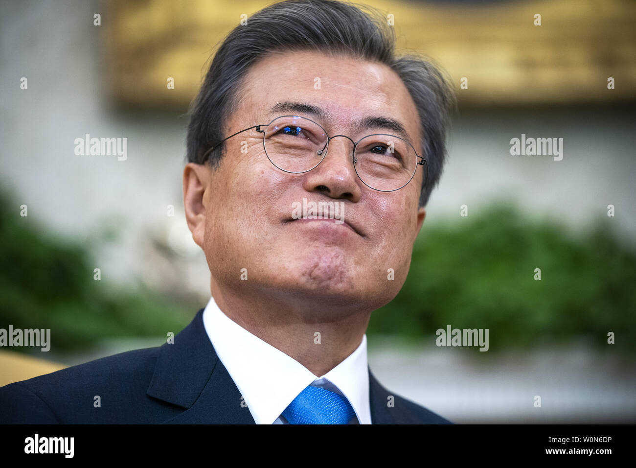 South Korean President Moon Jae-in listens to US President Donald J. Trump (not pictured) speak in the Oval Office of the White House White House in Washington on April 11, 2019. President Moon is expected to ask President Trump to reduce sanctions on North Korea in an attempt to jump start nuclear negotiations between North Korea and the US.  Photo by Jim Lo Scalzo/UPI Stock Photo