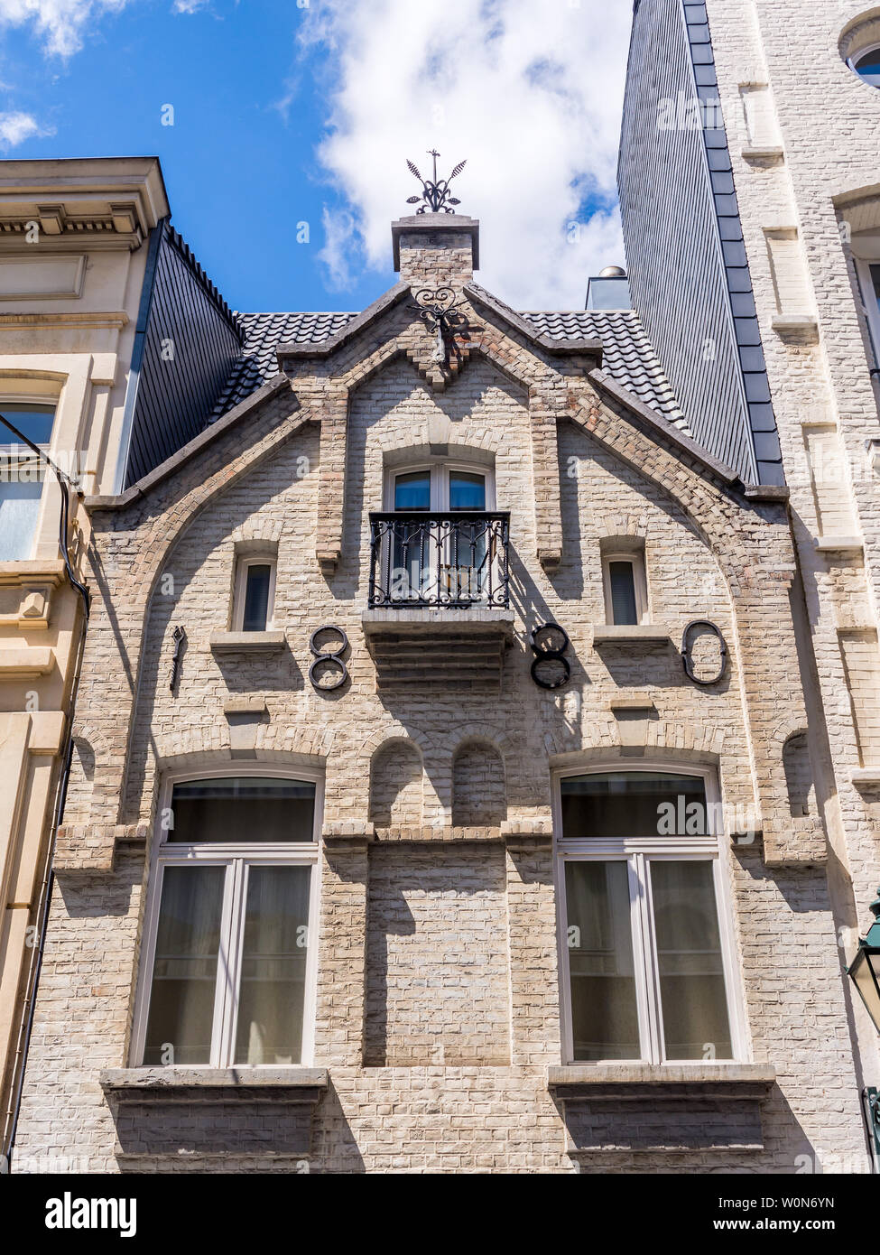 Stone building with 1880 construction date on facade - Brussels, Belgium. Stock Photo