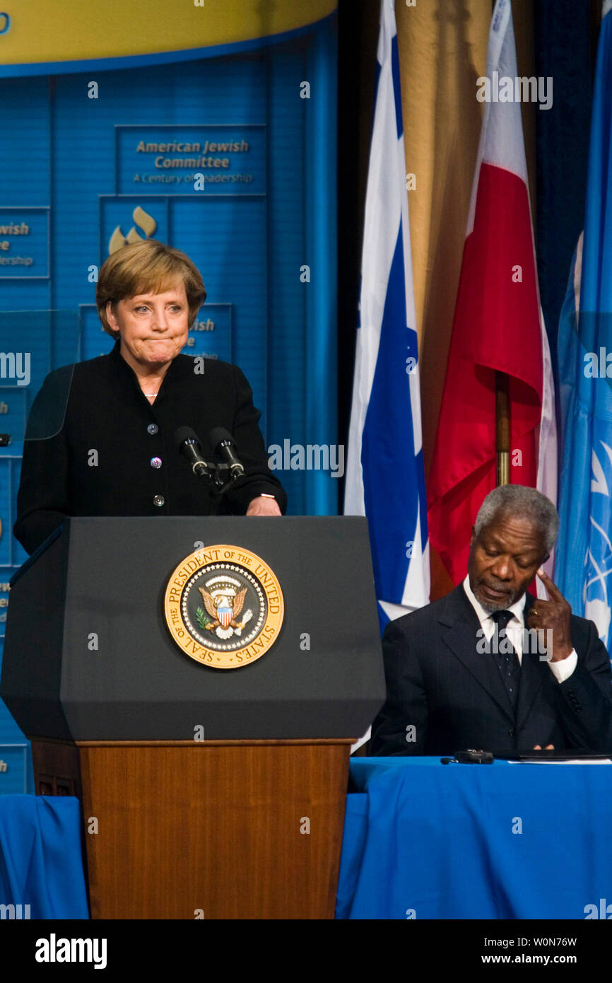 United Nations Secretary-General Kofi Annan (R) listens as Germany's Chancellor Angela Merkel addresses the American Jewish Committee 100th annual meeting in Washington May 4, 2006. (UPI Photo/Kamenko Pajic) Stock Photo