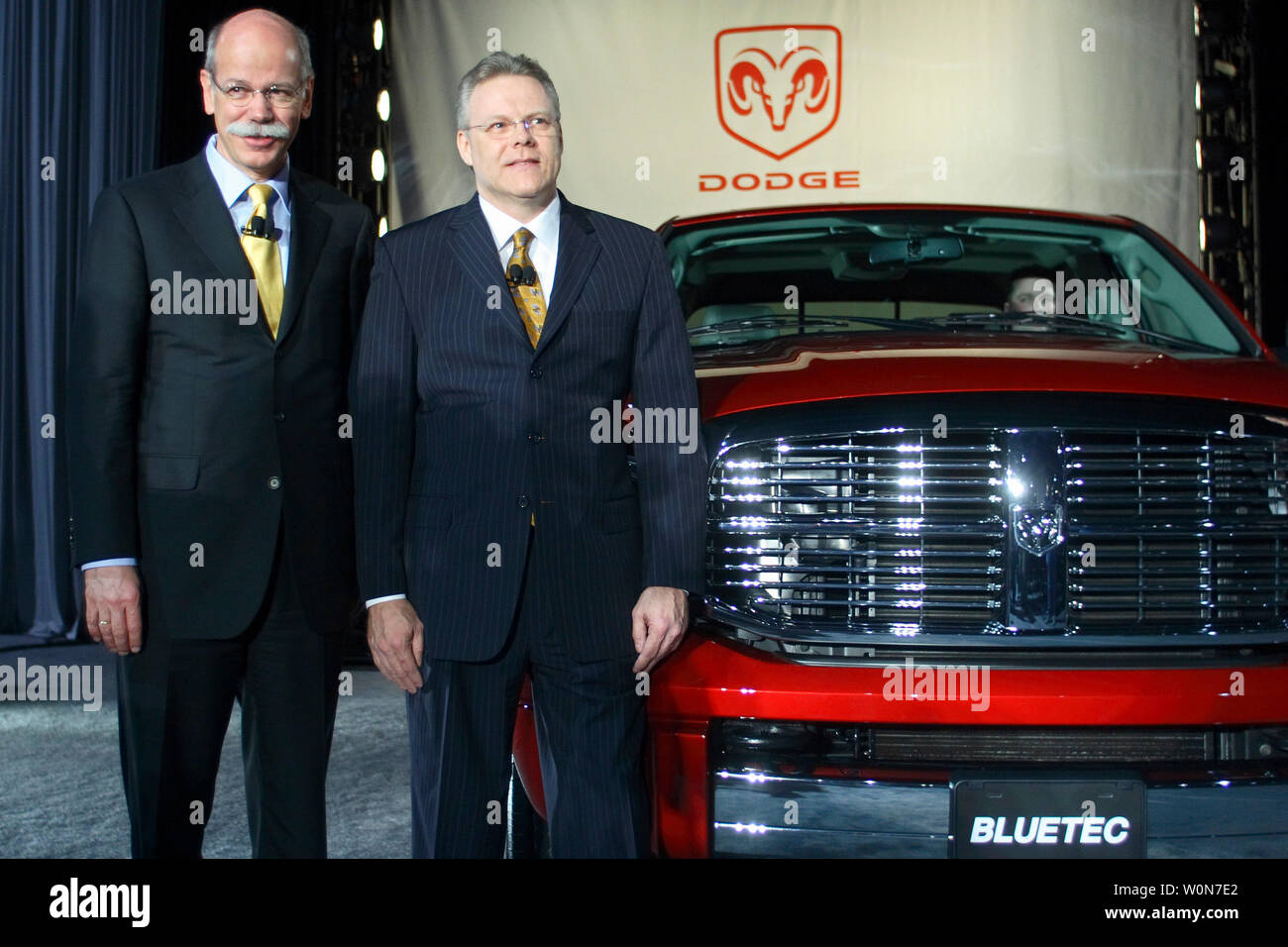 Dieter Zetsche, (L) chairman of the Board of Management of DaimlerChrysler AG and the head of Mercedes Car Group and Thomas W. LaSorda, Chrysler Group President and CEO, poses with new 2007 Dodge Ran 3500 at that Washington Car Show on January 23, 2007. The Dodge Ram Heavy Duty 6.7 liter with turbo-diesel engine that use emotion reduction technologies reducing Nitrogen oxide emotion by 90% meeting EPA's 2010 EPA clean diesel standards. (UPI Photo/Kamenko Pajic ) Stock Photo
