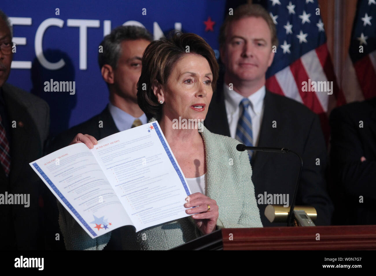 House Speaker Nancy Pelosi (D-CA) (R) flanked by Rahm Emanuel (D-IL)(L), and Chris Van Hollen (D-MD) speaks to reporters marking first 100 days of Democrat run Congress on Capitol Hill in Washington, March 28, 2007. (UPI Photo/ Kamenko Pajic) Stock Photo