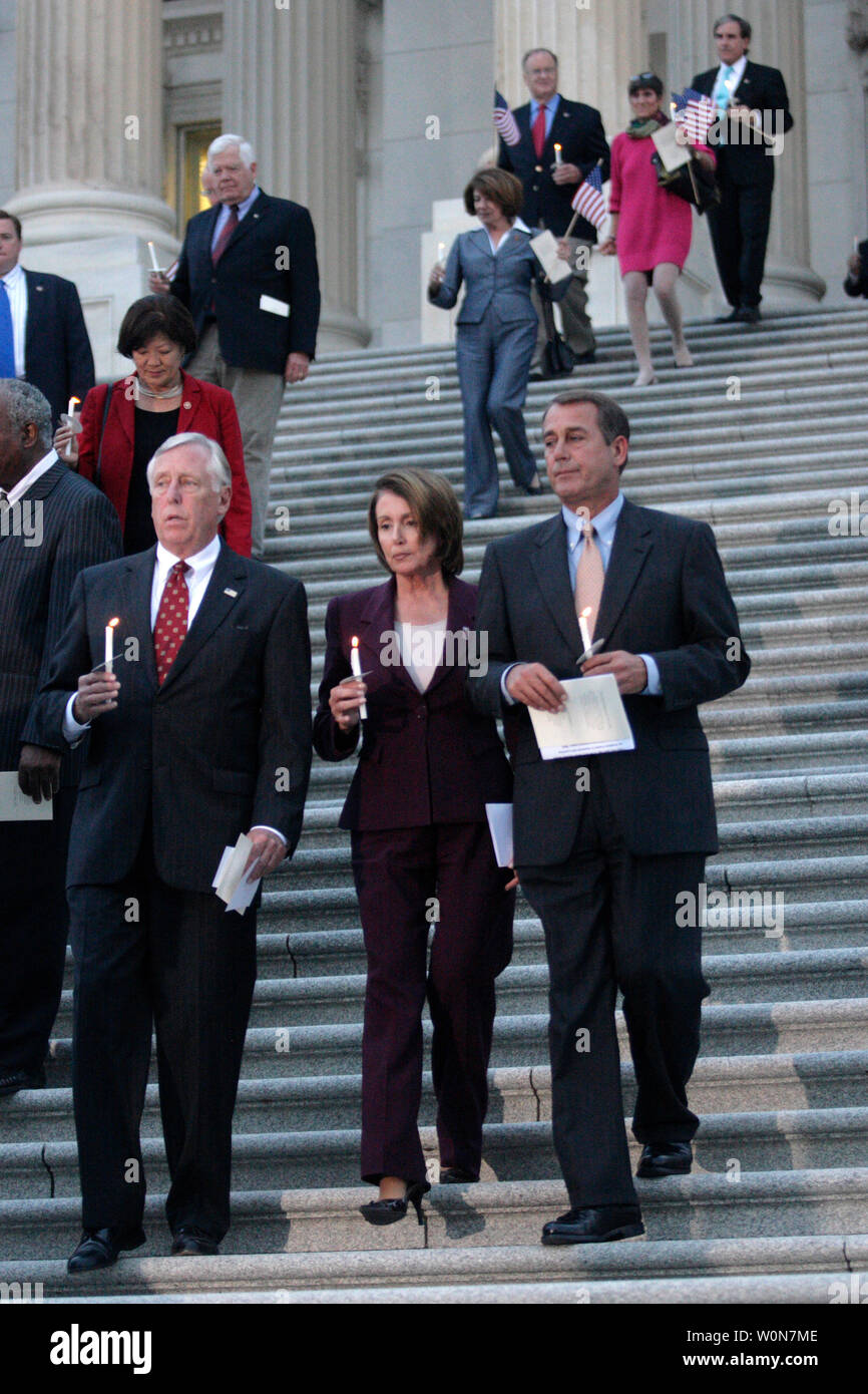 Speaker of the House Nancy Pelosi (D-CA) flanked by Rep. Steny Hoyer (D-MD) (L) and House Minority Leader John Boehner (R-OH) (R) join members of Congress during 9/11 Remembrance Ceremony on Capitol Hill in Washington on September 10, 2007.  (UPI Photo/ Kamenko Pajic) Stock Photo