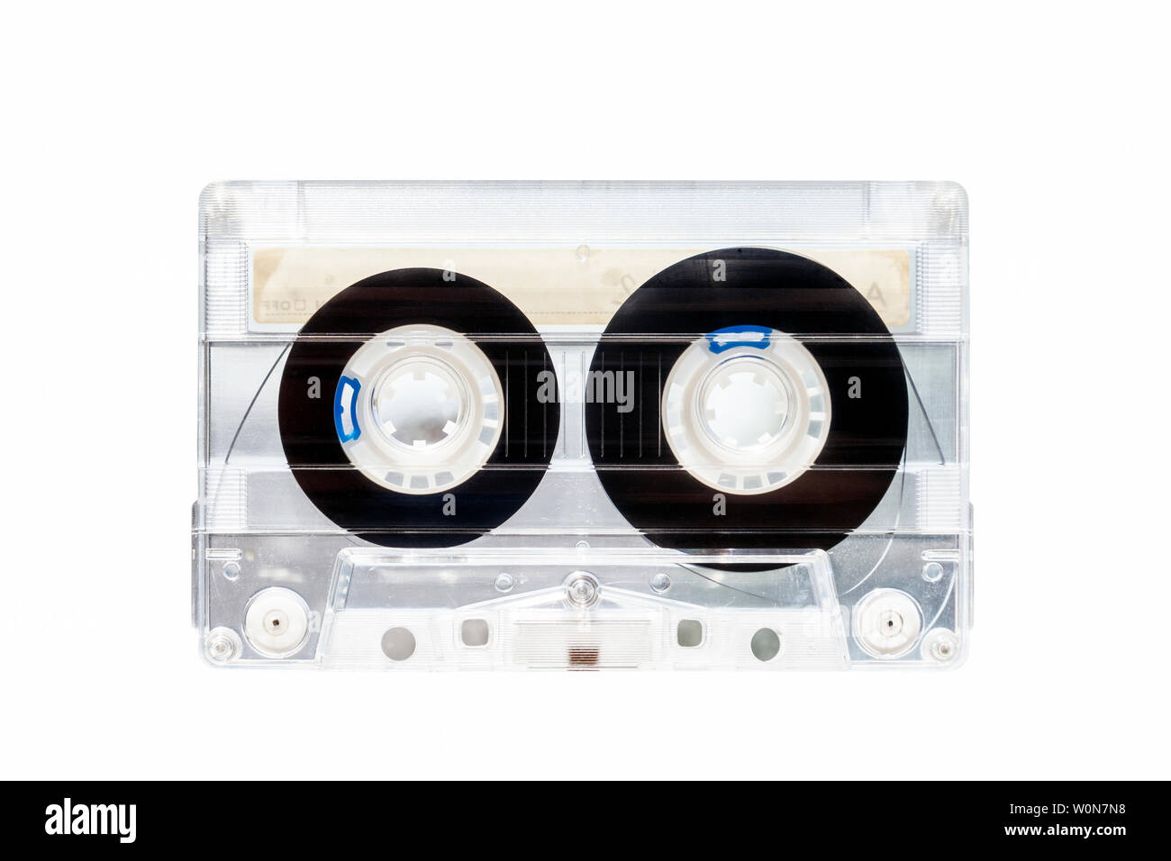 Transparent plastic C90 compact cassette audio tape isoltaed against a white background Stock Photo