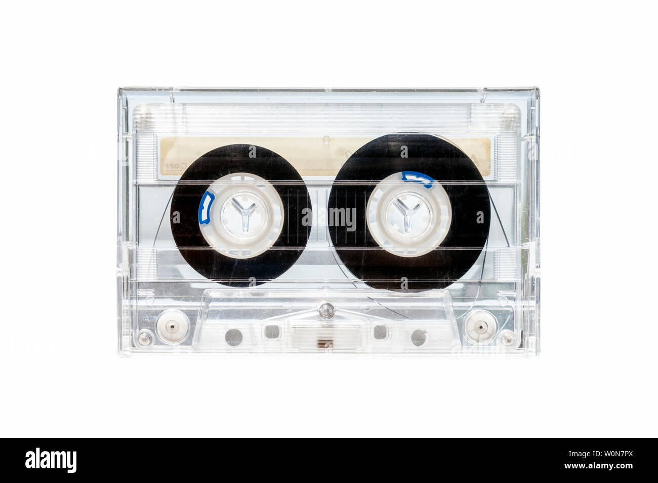 Transparent plastic C90 compact cassette audio tape in its case isolated against a white background Stock Photo