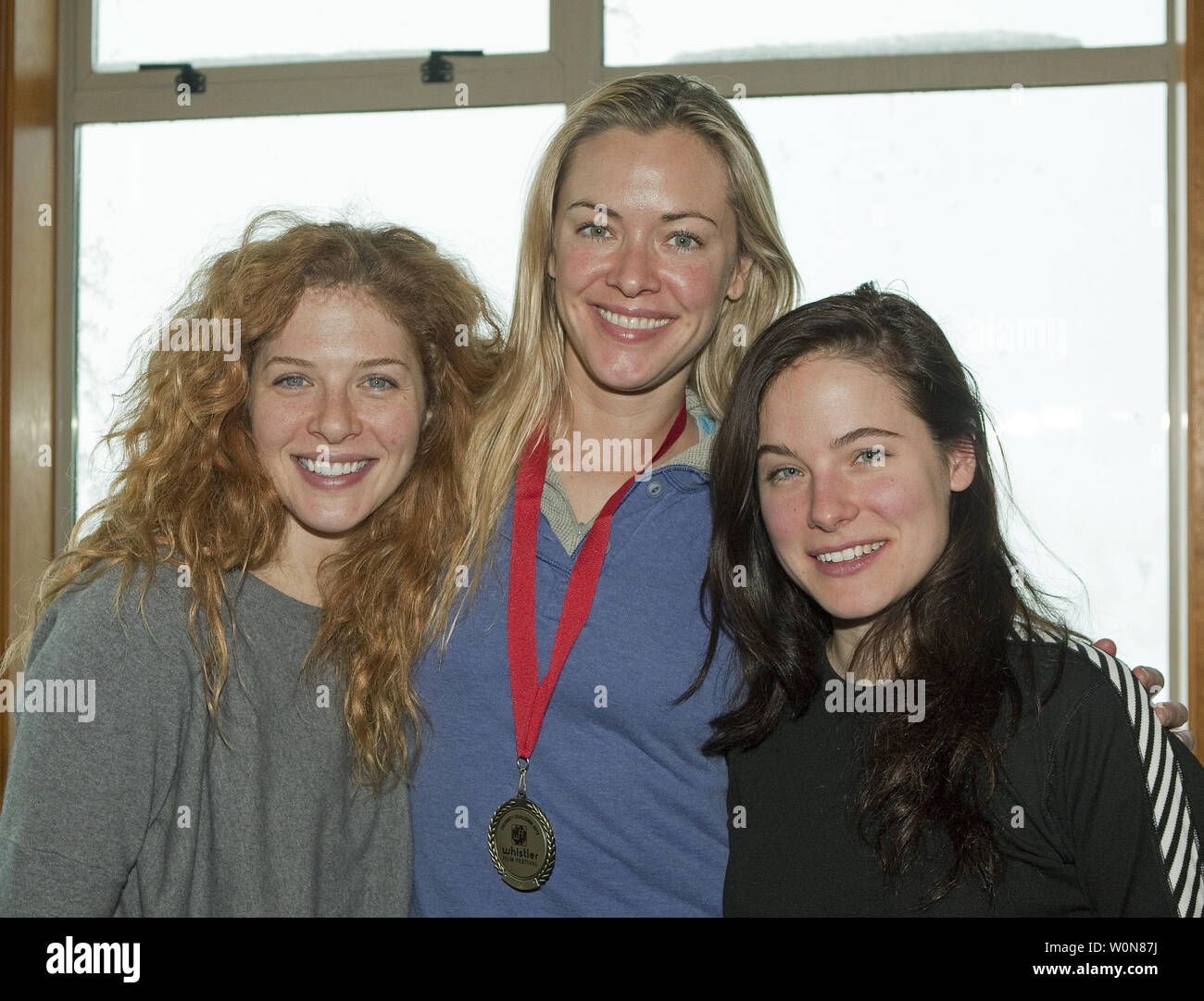 Actors Rachelle Lefevre (L) and Caroline Dhavernas (R) congratulate fellow actress and producer Kristanna Loken (centre), who's team 'Scar Tissue' finished with the best combined time in the Celebrity Challenge Ski Race during the awards luncheon at Steeps Grill atop Whistler Mountain in Whistler, British Columbia, December 1, 2012 during the 2012 Whistler Film Festival.     UPI Photo /Heinz Ruckemann Stock Photo