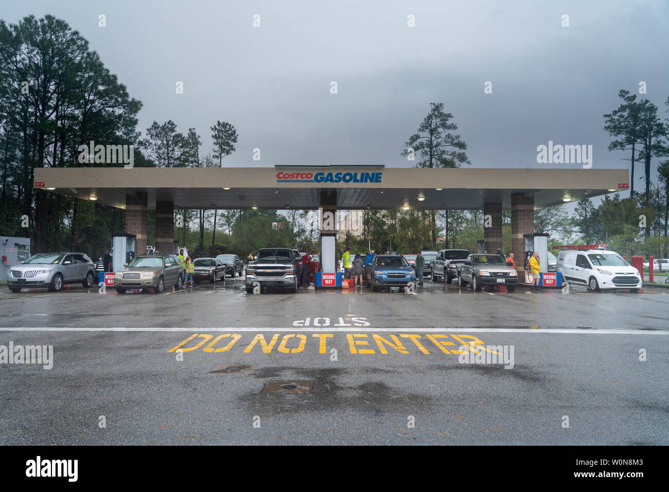 Local residents who waited in line for up to three hours, wait for gas pumps at a Costco gas station to open following tropical storm Florence September 16, 2018 in Wilmington, North Carolina. Florence, now a tropical storm is continuing to dump rain on North and South Carolina.     Photo by Ken Cedeno/UPI Stock Photo