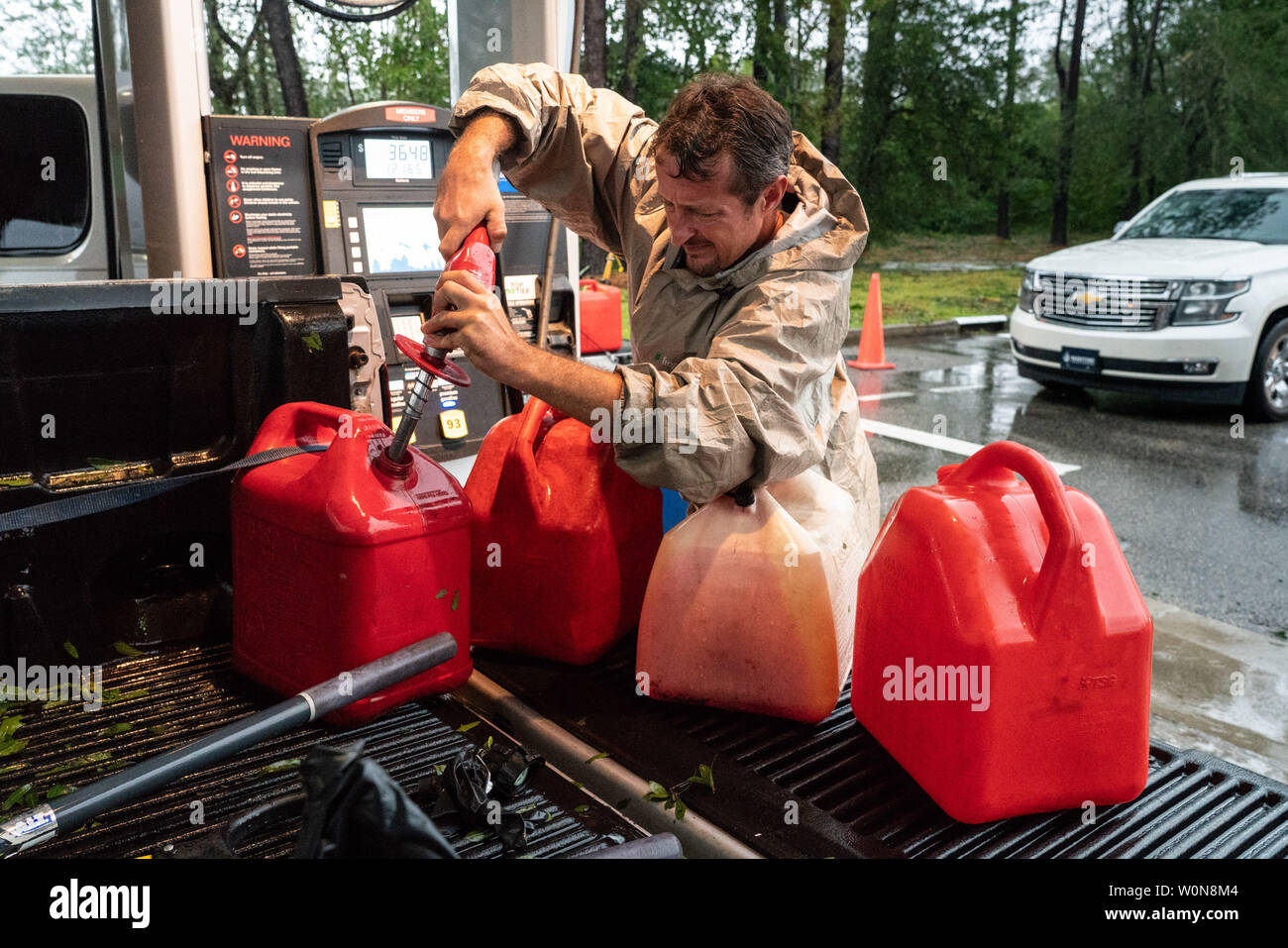 Winston Garrett, who waited in line for three hours, pumps gas at a Costco gas station following tropical storm Florence September 16, 2018 in Wilmington, North Carolina. Florence, now a tropical storm is continuing to dump rain on North and South Carolina.     Photo by Ken Cedeno/UPI Stock Photo