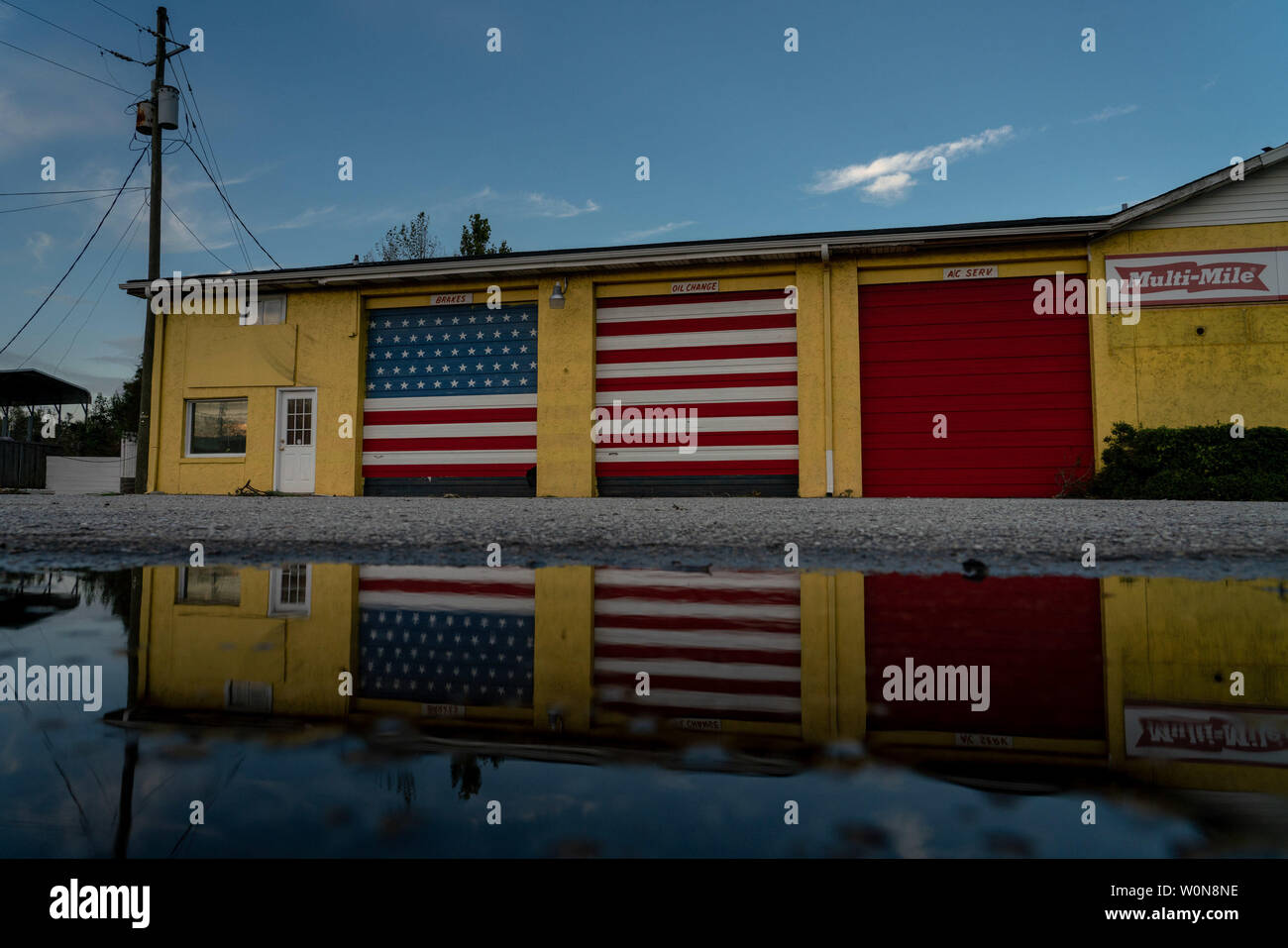 Mural of the American flag painted on garage doors of an auto repair place following Hurricane Florence, now tropical depression September 17, 2018 in Myrtle Grove, North Carolina. Florence, is continuing to dump rain on North and South Carolina and the Cape Fear River Valley and other rivers will rise breaking record flood levels.     Photo by Ken Cedeno/UPI Stock Photo
