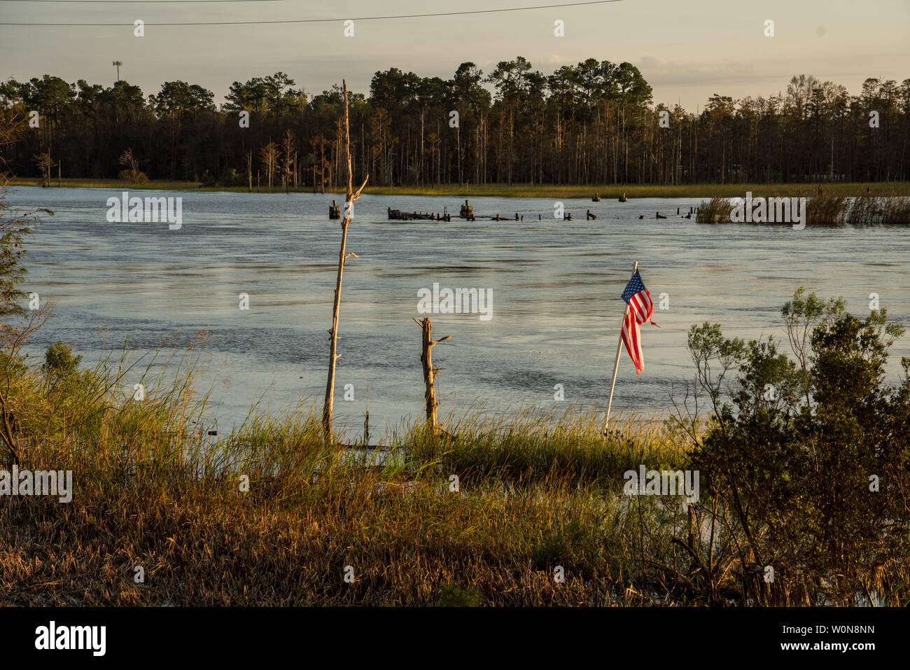 A torn flag stands on the Cape Fear River following Hurricane Florence, now tropical depression September 17, 2018 in Wilmington, North Carolina. Florence, is continuing to dump rain on North and South Carolina and the Cape Fear River Valley and other rivers will rise breaking record flood levels.     Photo by Ken Cedeno/UPI Stock Photo