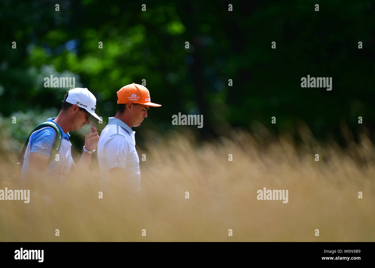 Rickie Fowler walks past tall grass to the No. 4 tee box during the final round of the 117th U.S. Open golf tournament at Erin Hills golf course on June 18, 2017, in Erin, Wisconsin. Photo by Kevin Dietsch/UPI Stock Photo