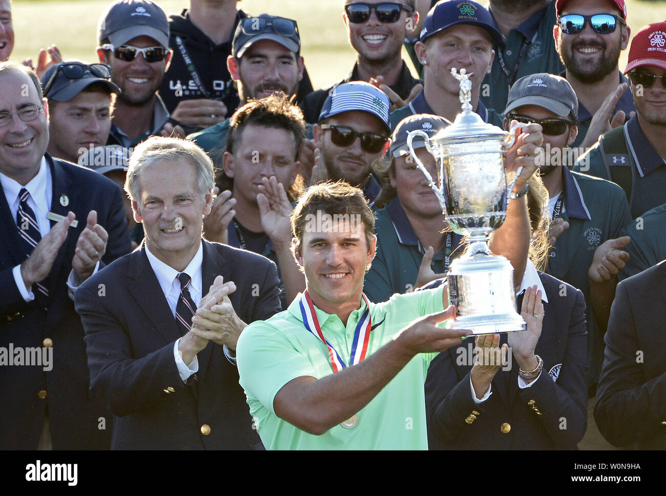 Brooks Koepka holds the trophy after his victory in the 117th U.S. Open