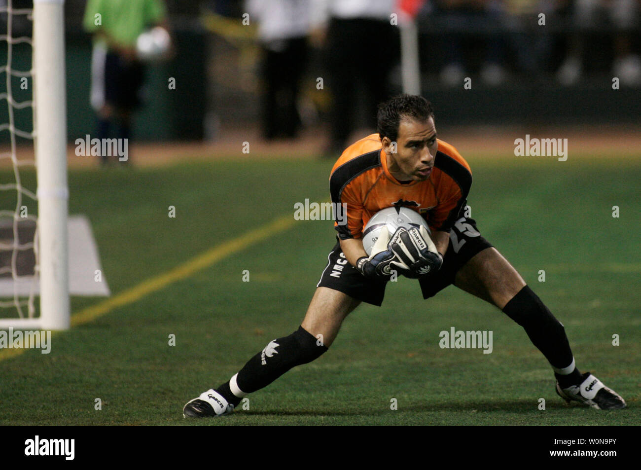 UANL Tigres goalie Rogelio Rodriguez hauls in a shot on goal by Mexico City's  Atlante on Jan. 2, 2005 in Phoenix, AZ.     (UPI Photo/Will Powers) Stock Photo