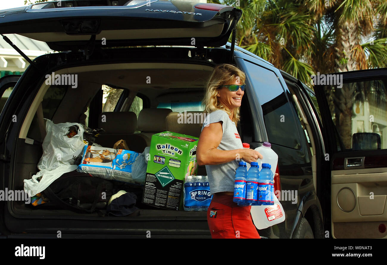 Donna Musso, 38, of Sewall's Point, Florida stocks up with water and other supplies in Jensen Beach, Florida, in preparation for Hurricane Wilma on October 23, 2005. Hurricane Wilma is moving off the Yucatan Peninsula into the Gulf of Mexico and is currently a category two hurricane   and is expected to hit Florida early Monday morning. (UPI Photo/Steve Mitchell) Stock Photo