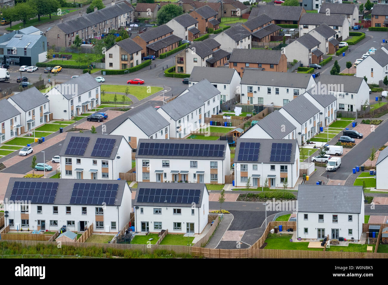 Elevated view of new houses with solar panels on roofs in Raploch