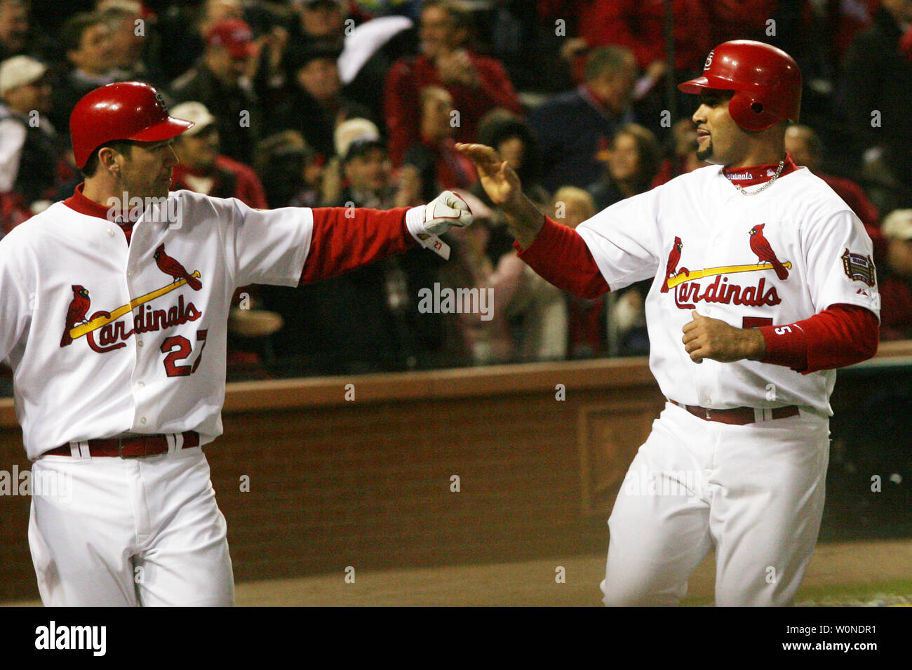St. Louis Cardinals Scott Rolen (L) and Albert Pujols celebrate after being  driven home on a double by Jim Edmonds in the fourth inning during the 2006  World Series against the Detroit