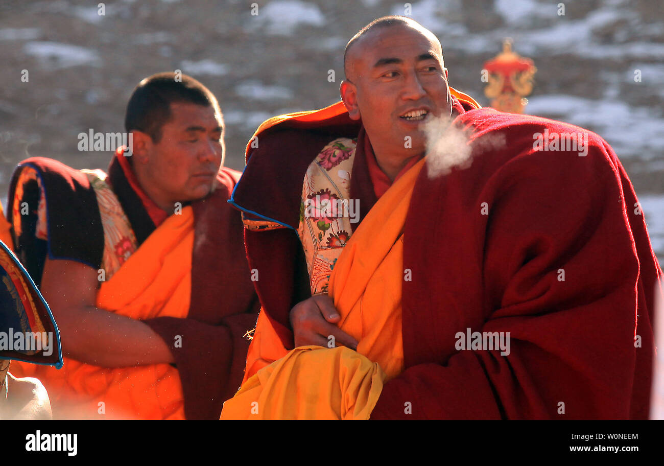 Tibetan monks prepare to celebrate the unveiling of a giant Thangka of ...