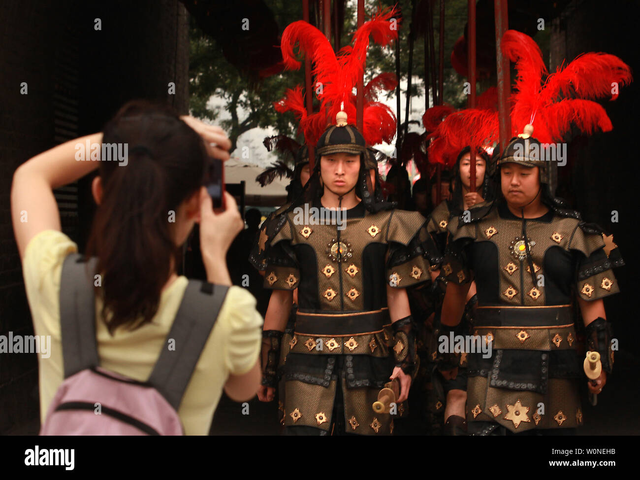 Chinese actors dressed in Tang Dynasty imperial military march to an outdoor stage inside the ancient Chinese walled city Xi'an, one of the oldest cities in China and the capital of Shaanxi Province on June 26, 2012.  Xi'an is one of the Four Great Ancient Capitals of China, having maintained the position under several of the most important Chinese dynasties. It is the most complete walled city that has survived in China.    UPI/Stephen Shaver Stock Photo