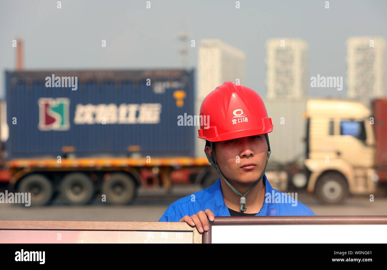 Chinese truck drivers transport cargo containers to a port in Yingkou, a major port city in Liaoning Province, on July 18, 2018.  China's Ministry of Commerce is pursuing a legal remedy with the World Trade Organization (WTO) against the U.S. over new tariffs on $200 billion worth of Chinese exports.     Photo by Stephen Shaver/UPI Stock Photo
