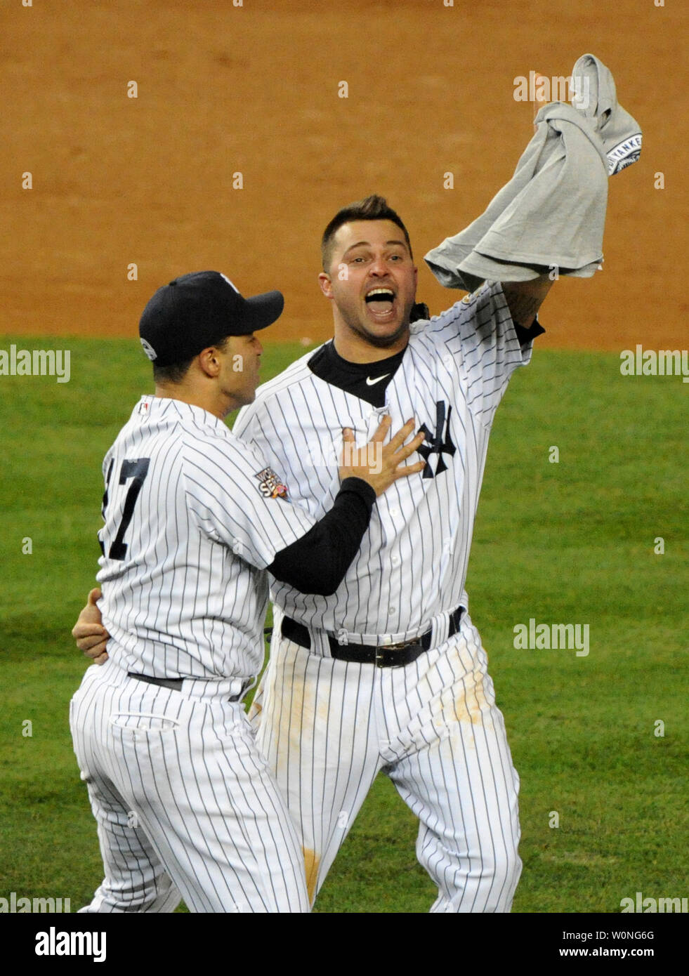 New York Yankees outfielders Nick Swisher (R) and Jerry Hairston, Jr.  celebrate the Yankees 27th World Series Championship in New York on  November 4, 2009. Yankees defeated the Philadelphia Phillies 7-3 in