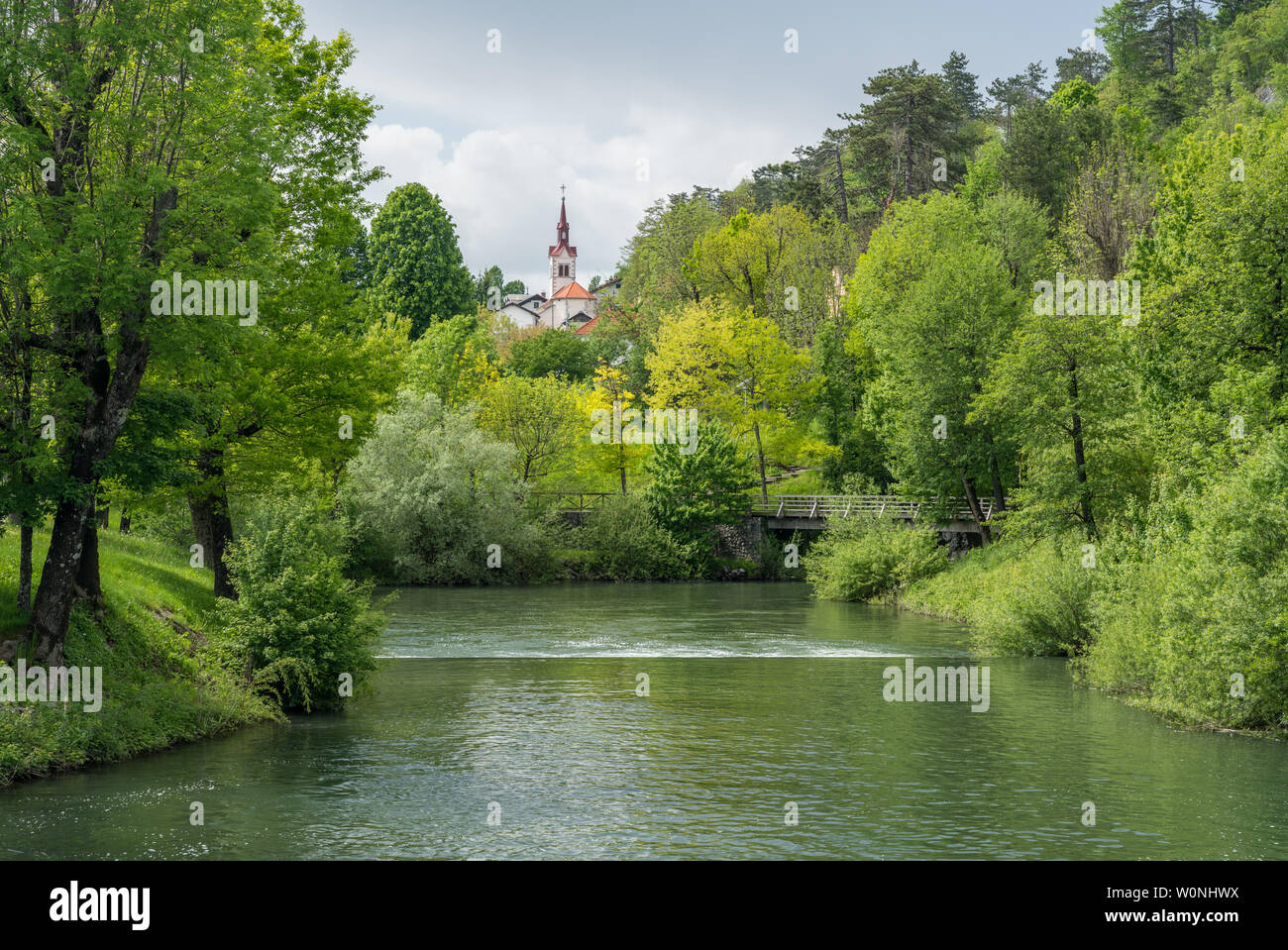 Calm peaceful river in the park near Postojna cave system in Slovenia Stock Photo