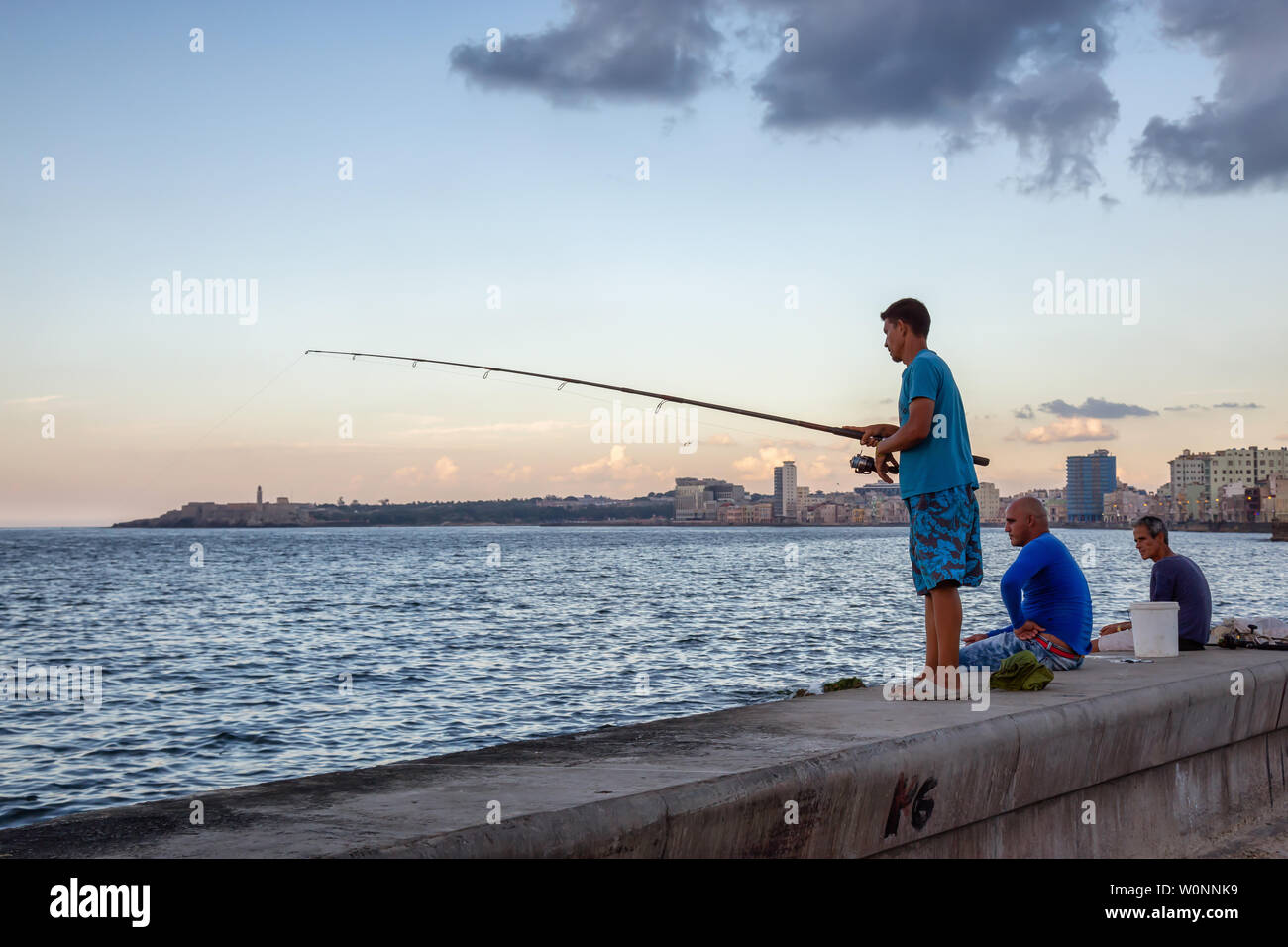 Havana, Cuba - May 12, 2019: Cuban people are fishing in the ocean, taken during the Shortage of Food Crisis. Stock Photo