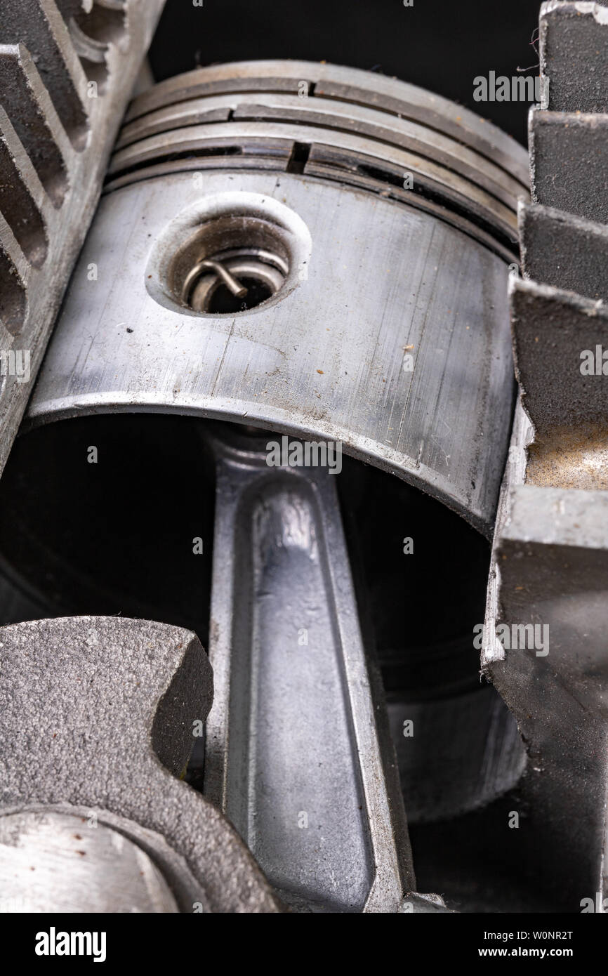 Piston of an internal combustion engine in a cut aluminum cylinder