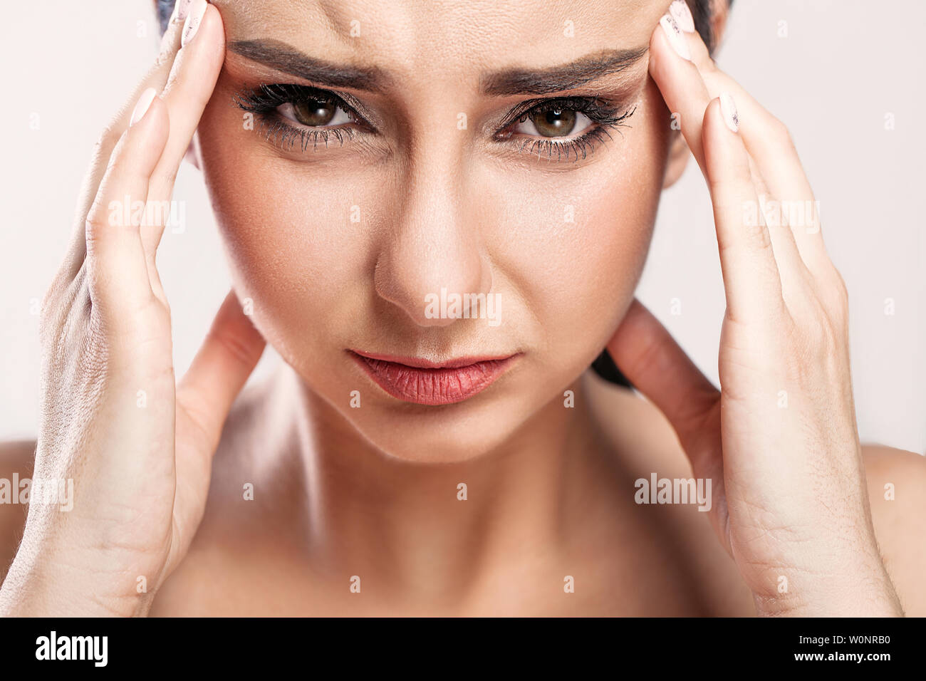Pain. Tired Exhausted Stressed Woman Suffering From Strong Eye Pain. Portrait Of Beautiful Young