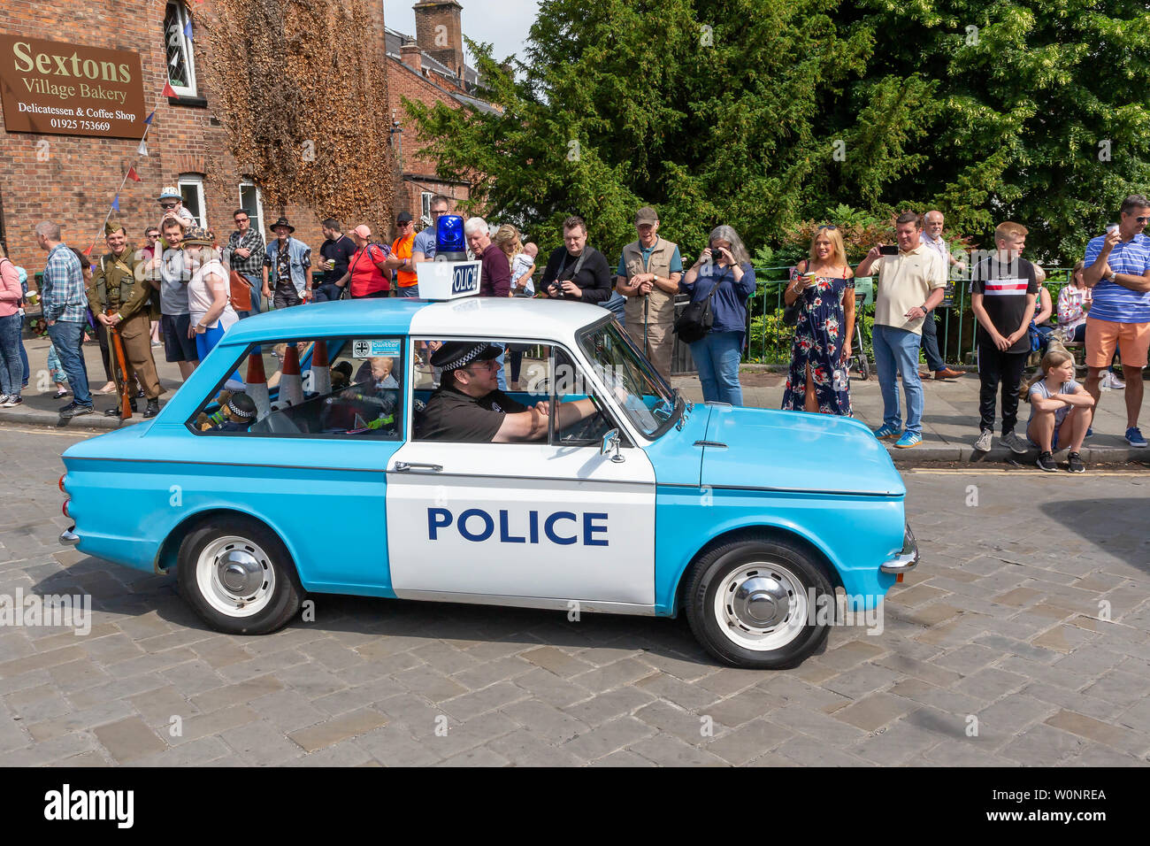 Clssic Hillman Imp police car in the Lymm Historic Transport parade through the village streets Stock Photo