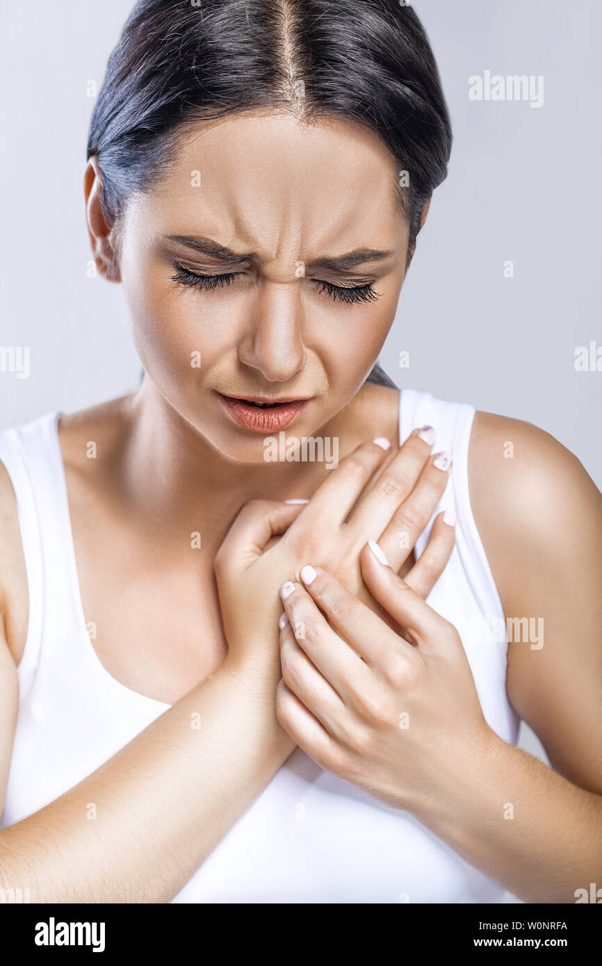Heart Health Care. Closeup Of Young Woman Feeling Strong Pain In Chest. Closeup Of Female Body