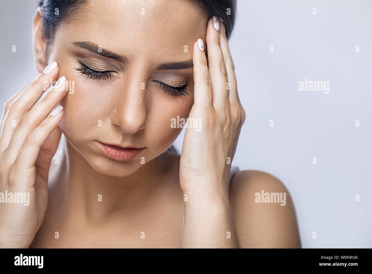 Pain. Tired Exhausted Stressed Woman Suffering From Strong Eye Pain. Portrait Of Beautiful Young