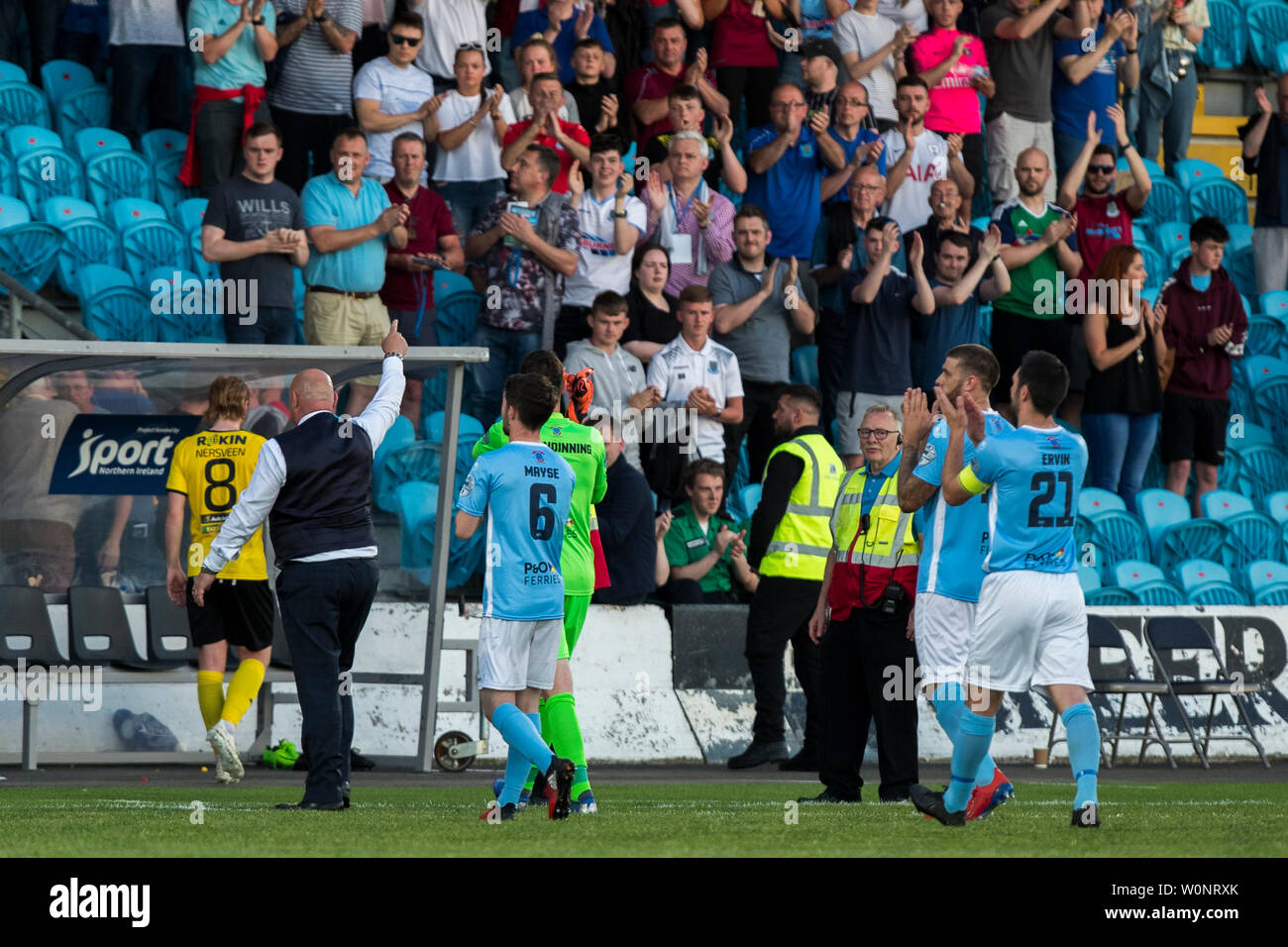 Ballymena United FC coach David Jeffrey (left) leads his team off the pitch after the Europa League Preliminary Round match at Ballymena Showgrounds, Northern Ireland. Stock Photo