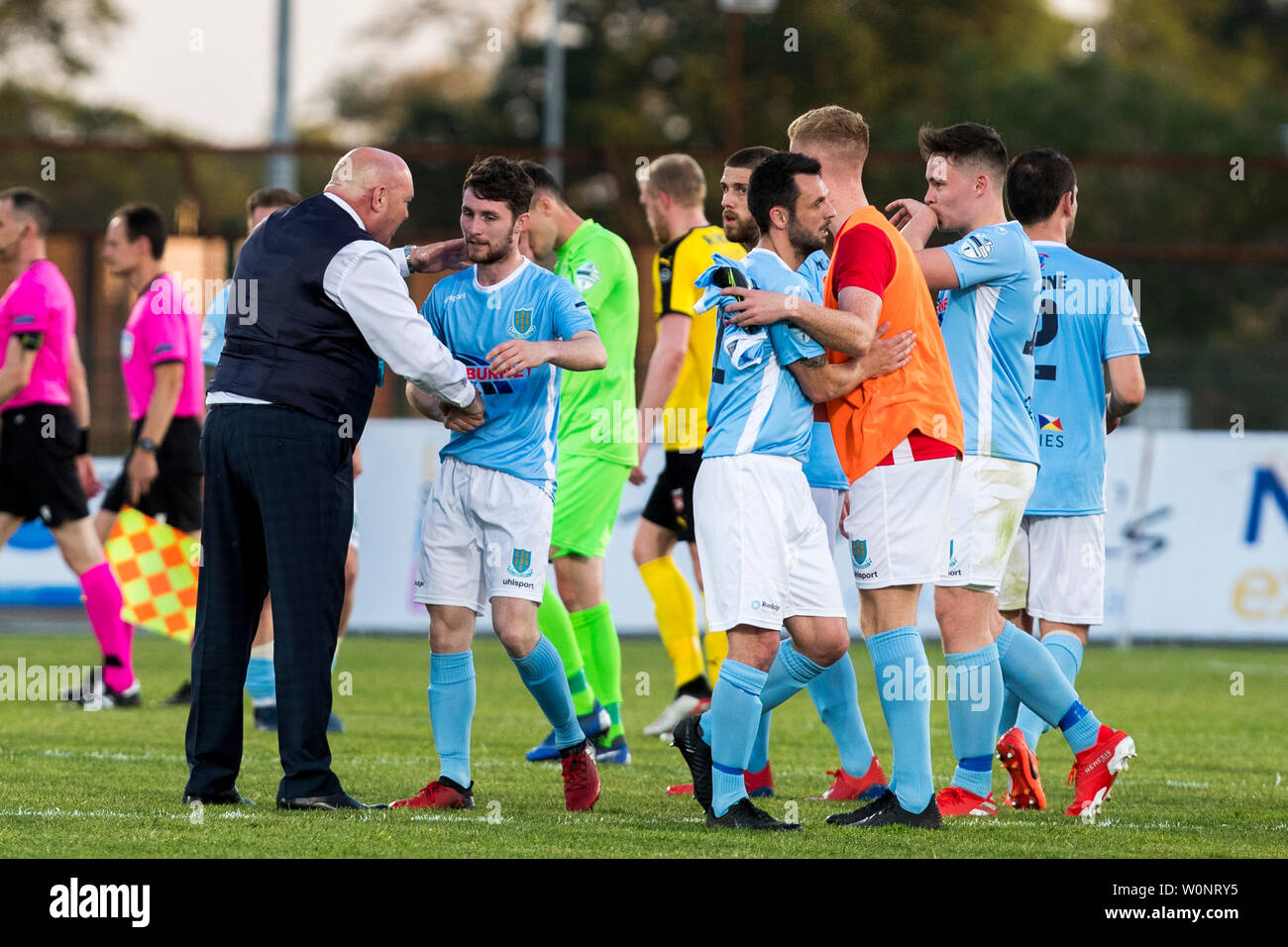 Ballymena United FC coach David Jeffrey (left) shakes hands with his player Ryan Mayse after the Europa League Preliminary Round match at Ballymena Showgrounds, Northern Ireland. Stock Photo