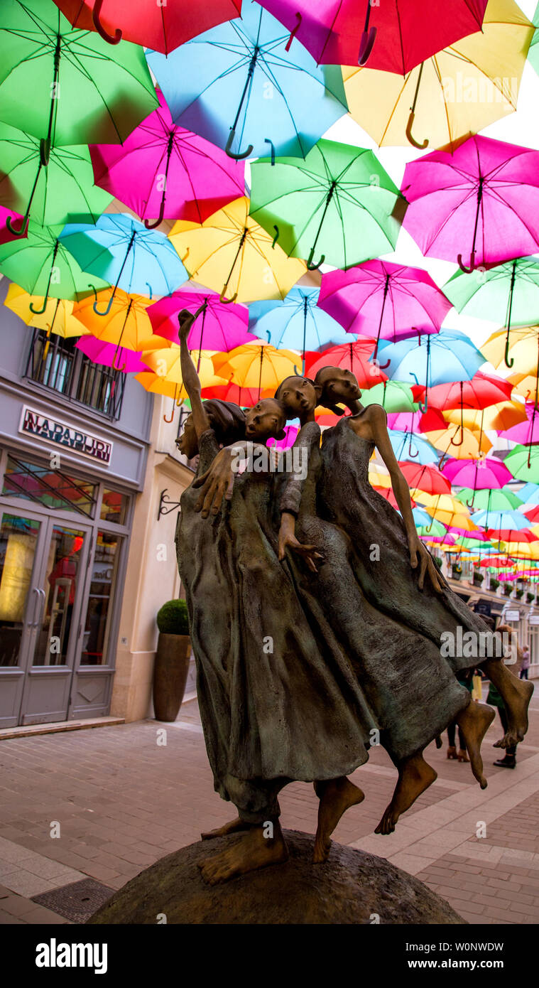 The Umbrella Sky Project by Patricia Cunha and the whimsical sculptures by Dirk De Kayzer delight visitors to Le Village Royal in Paris France Stock Photo