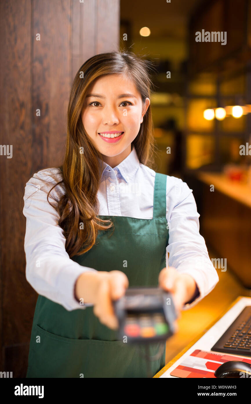 Make Waiters Make it waitress and waiter in cafe Stock Photo - Alamy