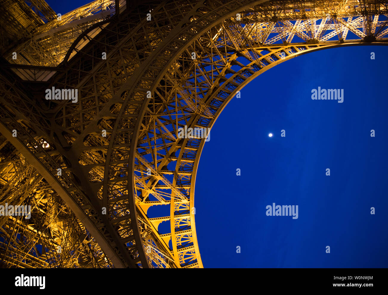 The famous Eiffel Tower, Paris France at night with moon Stock Photo
