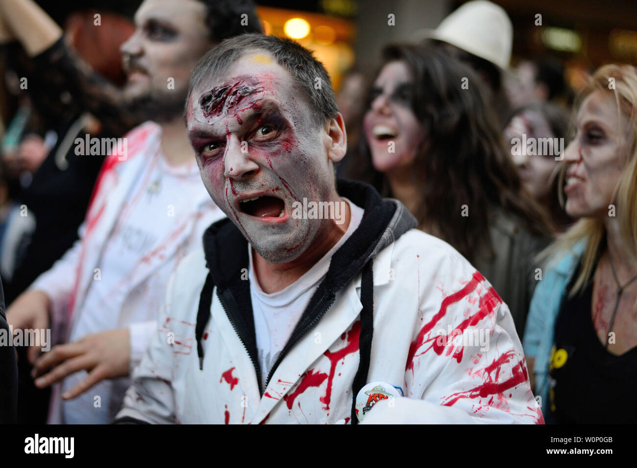 Belgrade, Serbia - October 19, 2013: People masked as zombies parades on streets during a zombie walk. Zombie walk is organized before Serbian SF movi Stock Photo
