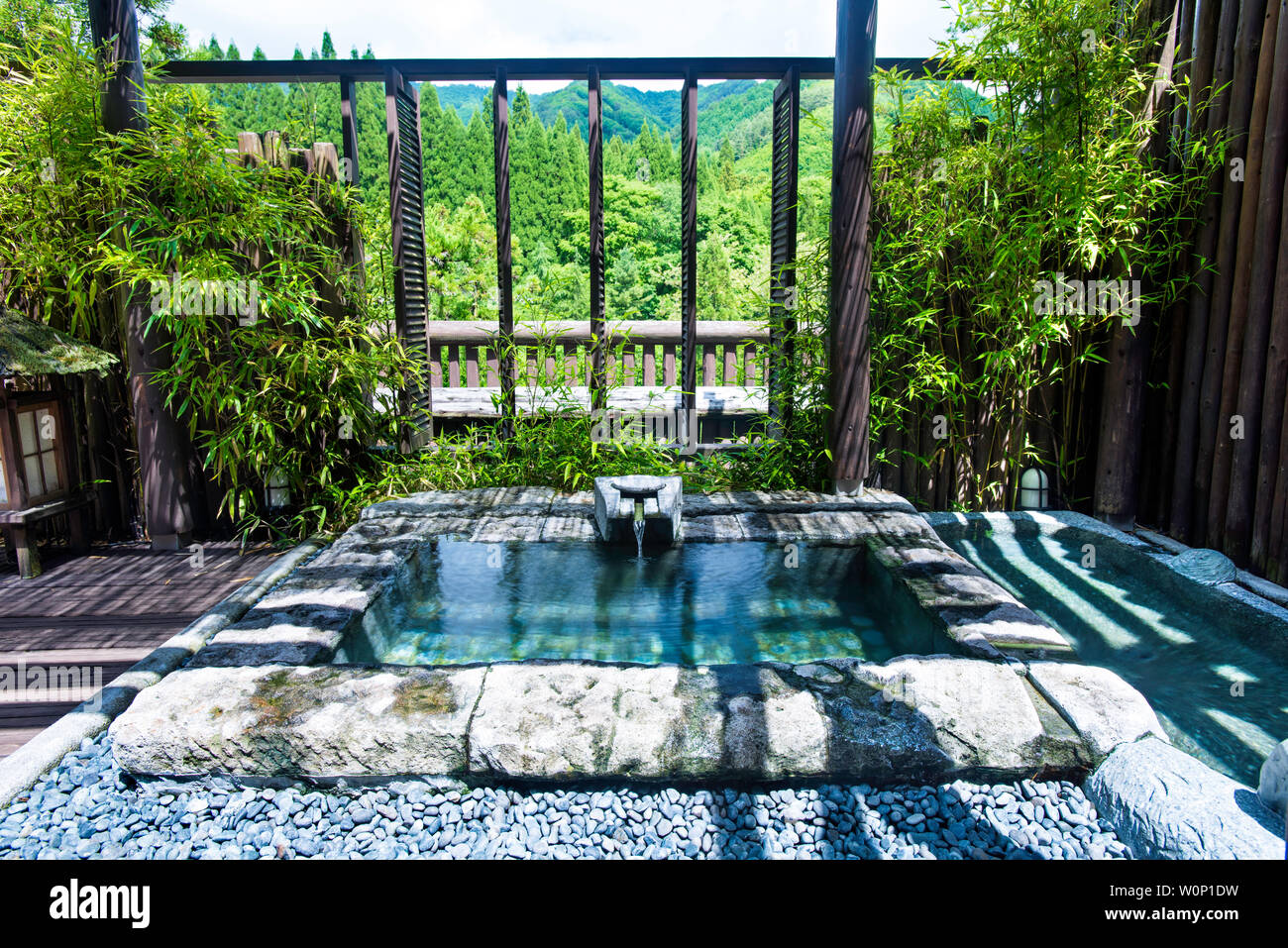 An outdoor bath, rotenburo at Iwanoyu, Nagano, Japan Stock Photo