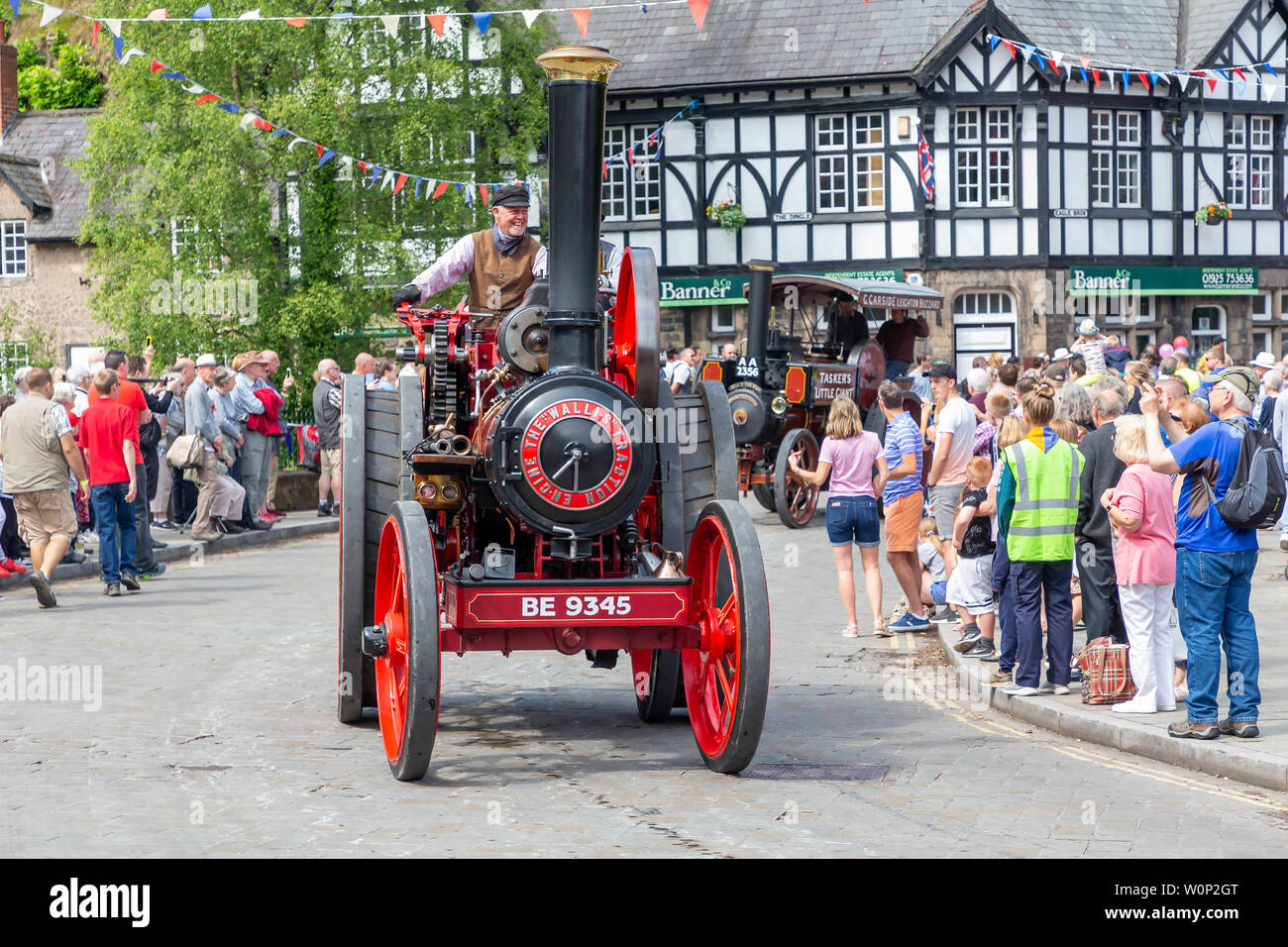 Line of traction engines in the Lymm Historic Transport parade through the village streets Stock Photo